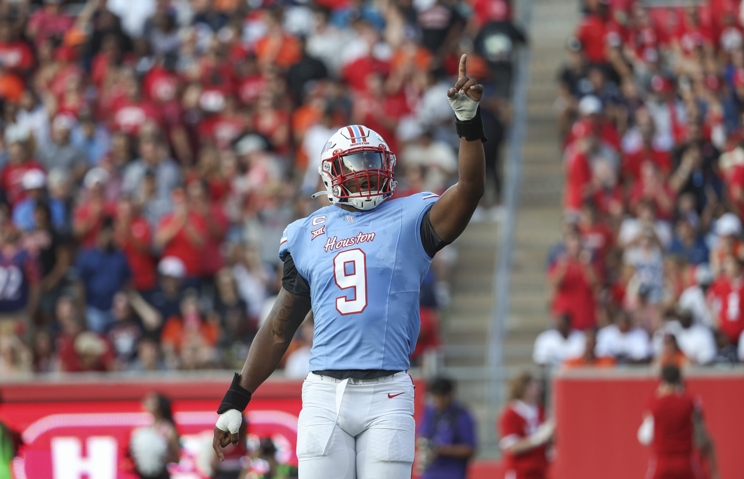 Sep 2, 2023; Houston, Texas, USA; Houston Cougars defensive lineman Nelson Ceaser (9) reacts after a play during the first quarter against the UTSA Roadrunners at TDECU Stadium.