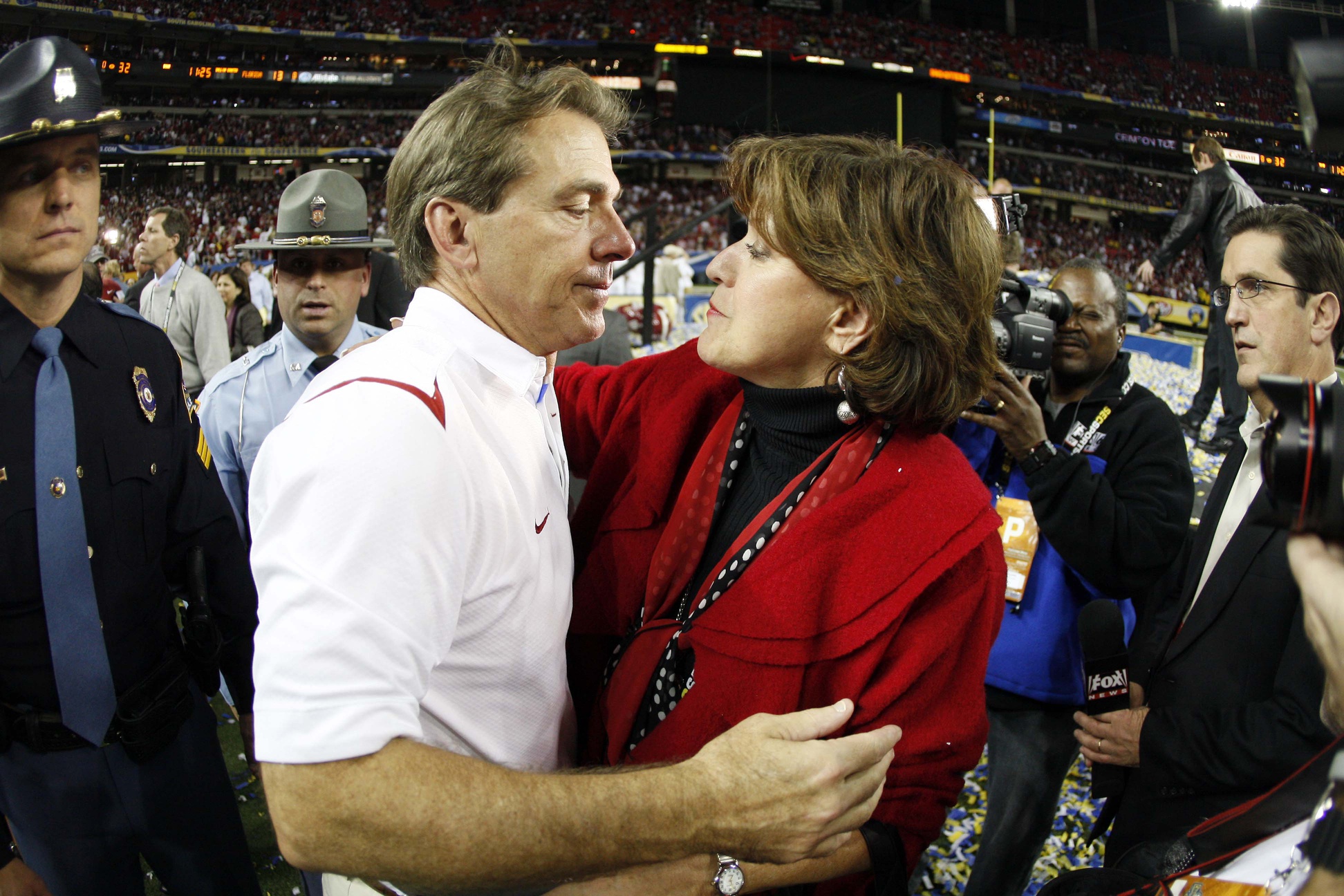 Dec 5, 2009; Atlanta, GA, USA; Alabama Crimson Tide head coach Nick Saban hugs wife Terry Saban after defeating the Florida Gators 32-13 in the 2009 SEC championship game at the Georgia Dome.