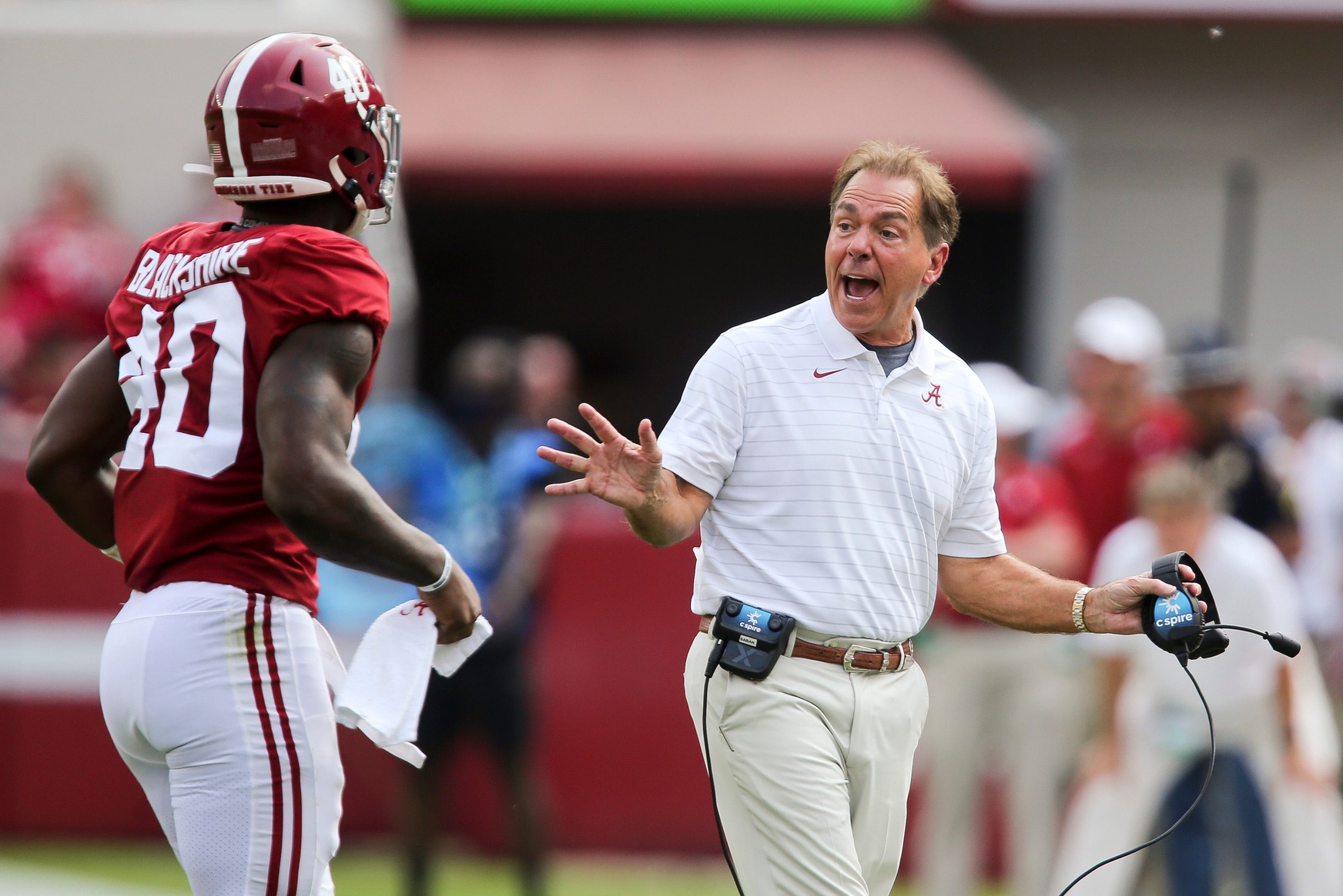 Alabama Head Coach Nick Saban speaks with Kendrick Blackshire as he leaves the field in Bryant-Denny Stadium.