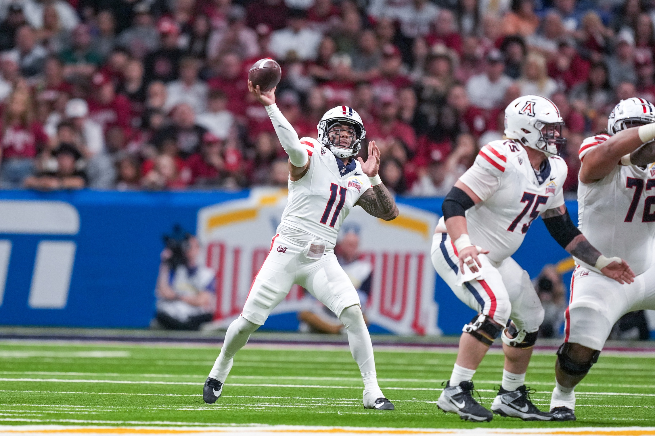Dec 28, 2023; San Antonio, TX, USA; Arizona Wildcats quarterback Noah Fifita (11) throws a pass against the Oklahoma Sooners in the first half at Alamodome. 