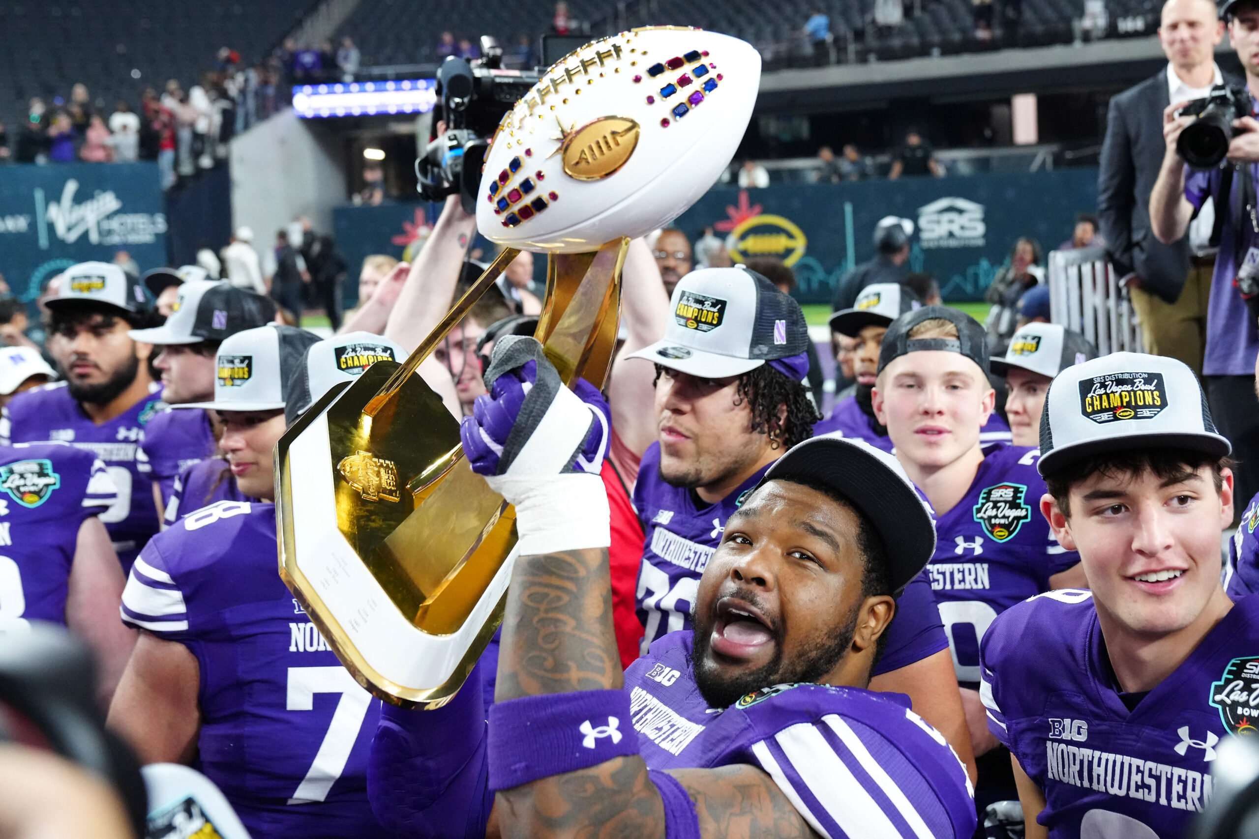 Dec 23, 2023; Las Vegas, NV, USA; Northwestern Wildcats defensive lineman R.J. Pearson (94) celebrates with team mates after the Wildcats defeated the Utah Utes 14-7 to win the Las Vegas Bowl at Allegiant Stadium.