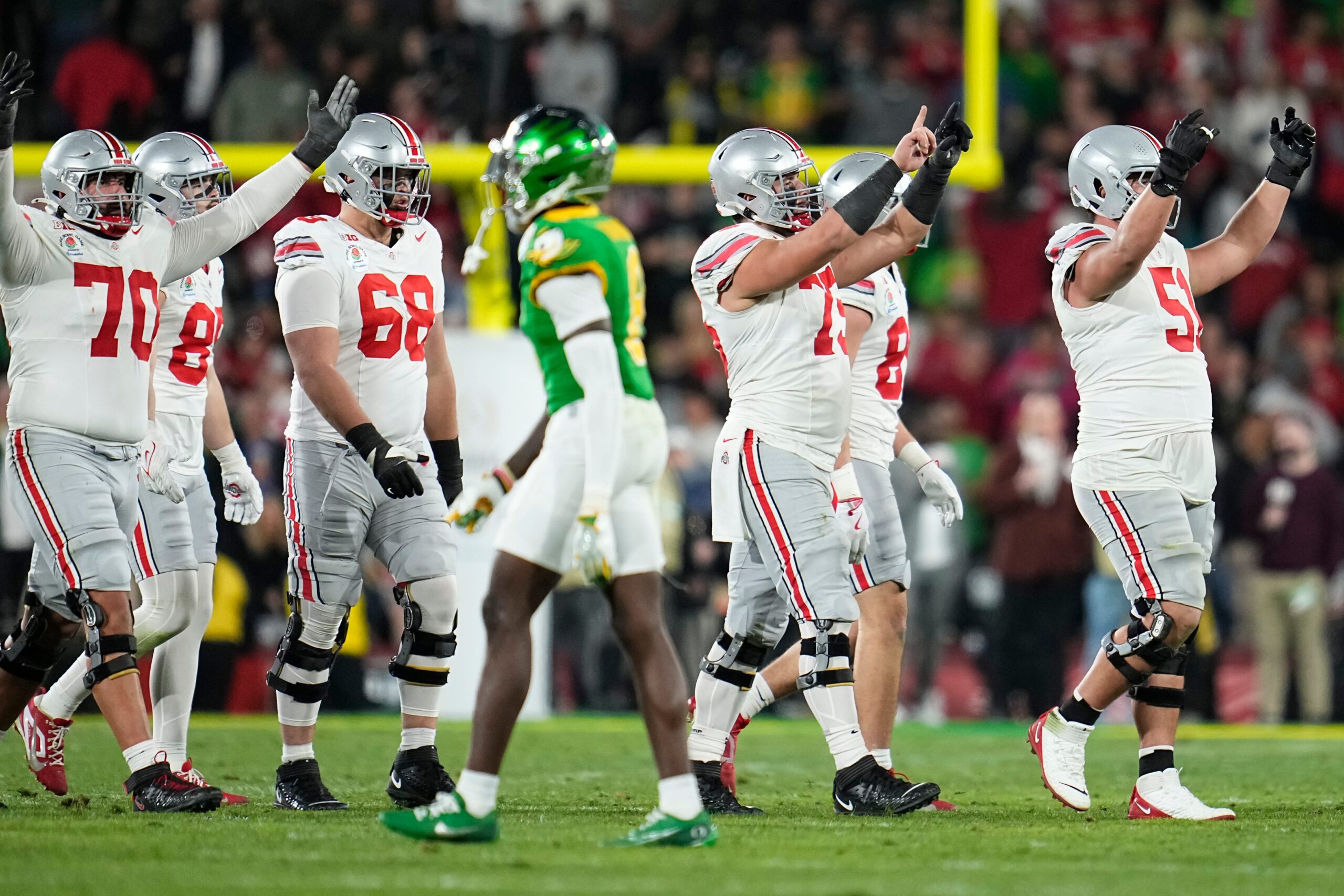 Ohio State Buckeyes offensive linemen cheer during the final seconds of the second half of the College Football Playoff quarterfinal against the Oregon Ducks at the Rose Bowl in Pasadena, Calif. on Jan. 1, 2025. Ohio State won 41-21.