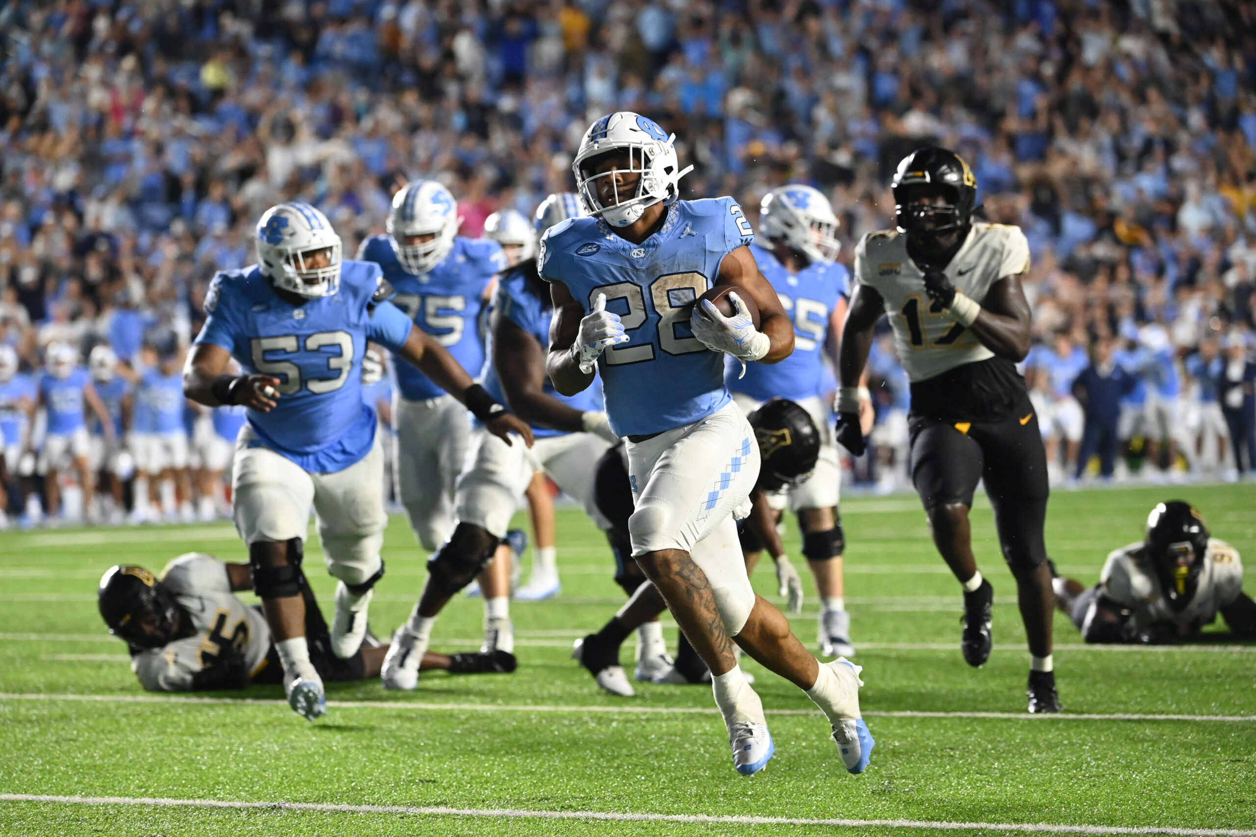 Sep 9, 2023; Chapel Hill, North Carolina, USA; North Carolina Tar Heels running back Omarion Hampton (28) runs for a touchdown in the first overtime at Kenan Memorial Stadium.