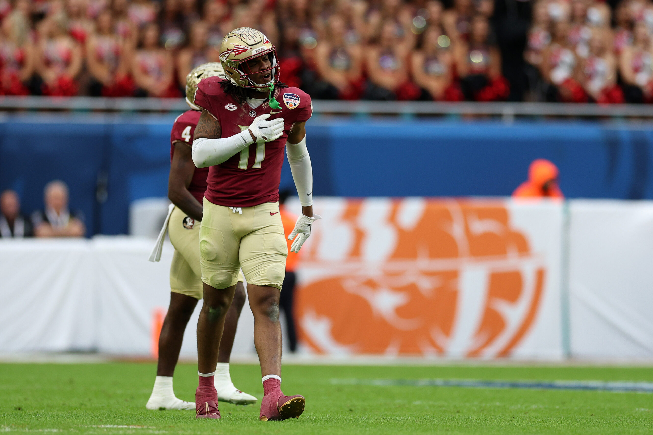 Dec 30, 2023; Miami Gardens, FL, USA; Florida State Seminoles defensive lineman Patrick Payton (11) reacts against the Georgia Bulldogs during the first half in the 2023 Orange Bowl at Hard Rock Stadium. 