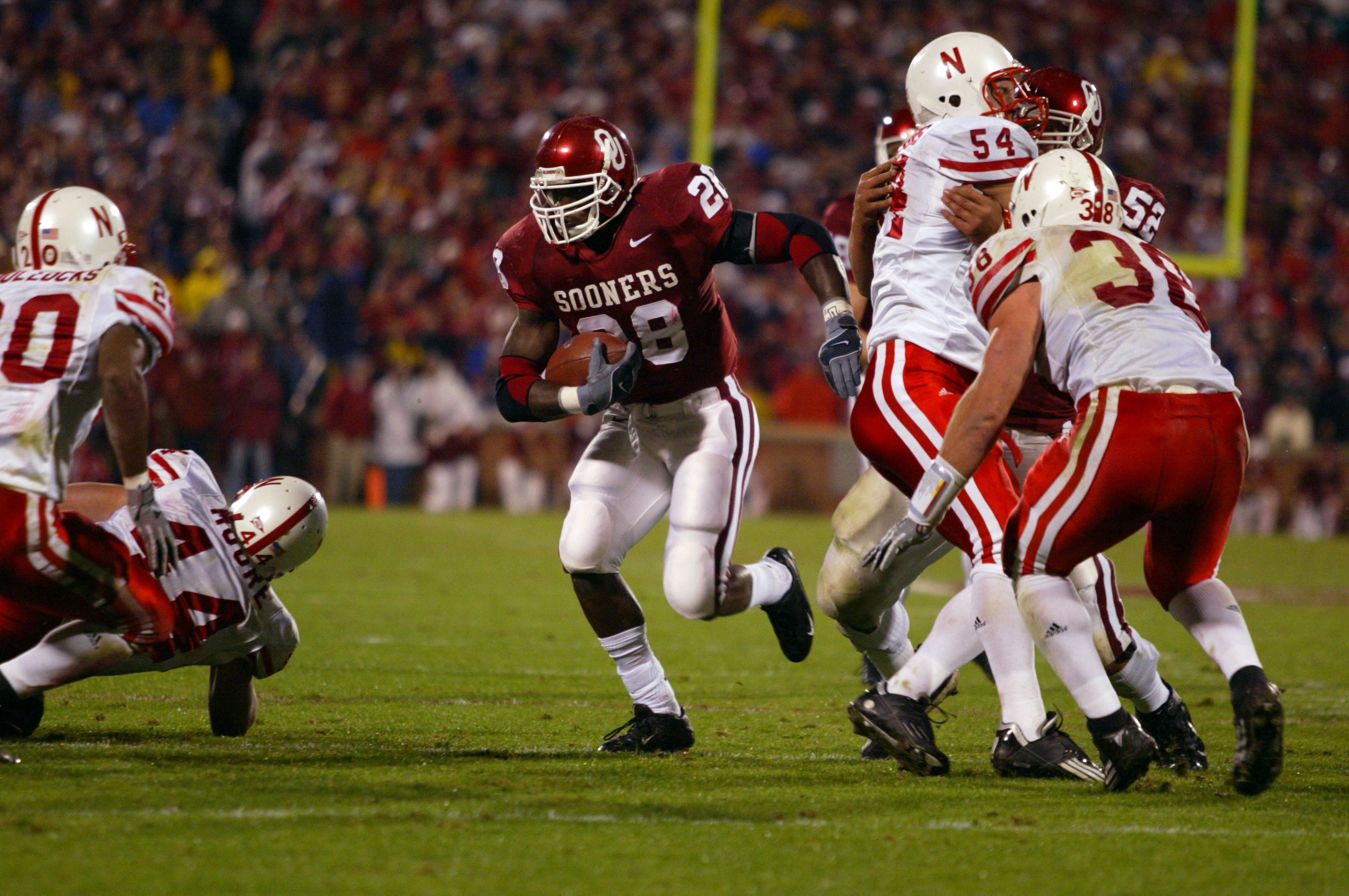 Nov. 13,2004; Norman, Oklahoma USA; Oklahoma Sooner running back Adrian Peterson #28 rushes against the Nebraska Cornhuskers during the 1st half of the game at Memorial Stadium. Mandatory Credit: Photo by Tim Heitman-USA TODAY Sports (c) Copyright 2004 Tim Heitman