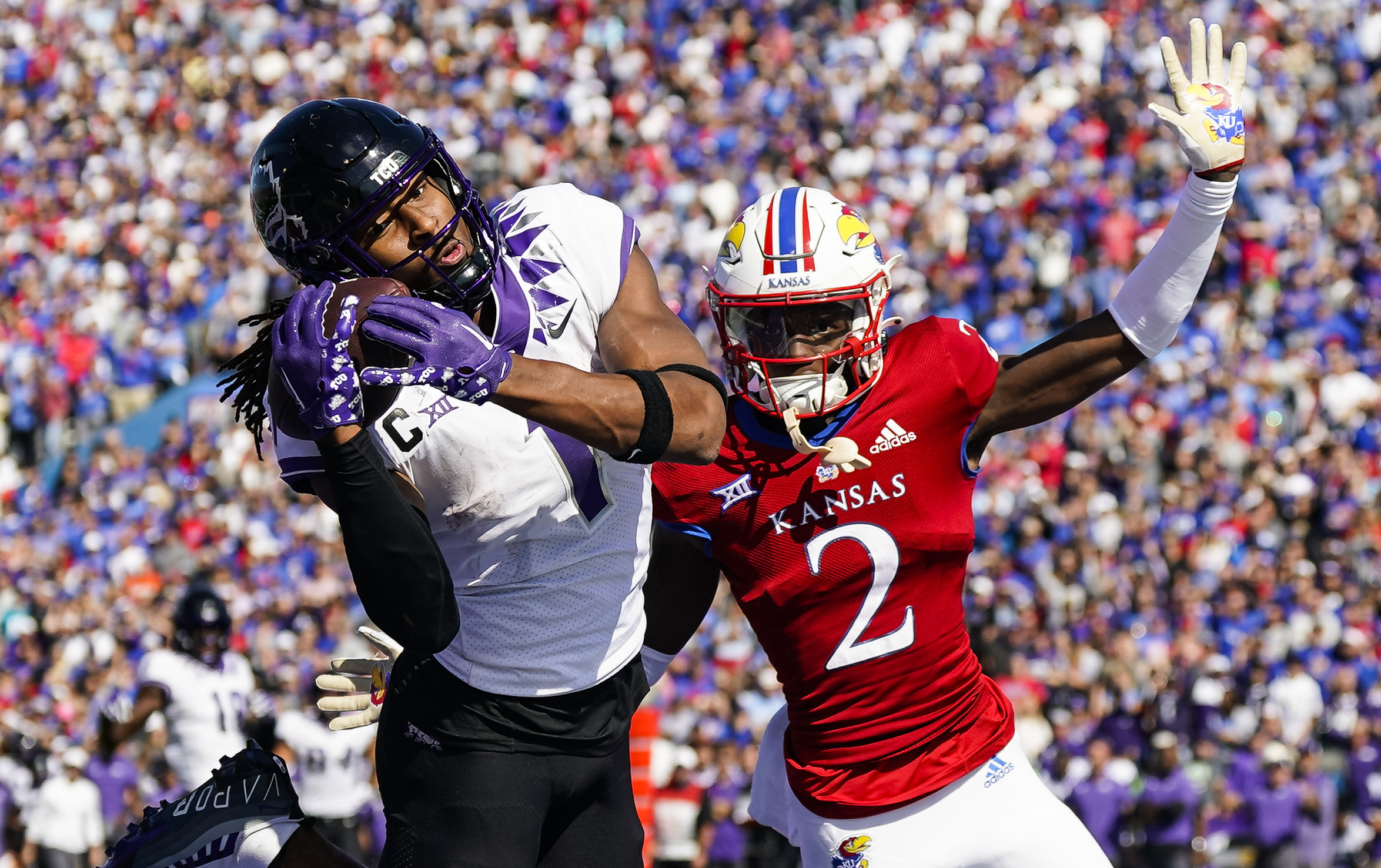 Oct 8, 2022; Lawrence, Kansas, USA; TCU Horned Frogs wide receiver Quentin Johnston (1) catches a touchdown pass against Kansas Jayhawks cornerback Cobee Bryant (2) during the second half at David Booth Kansas Memorial Stadium.