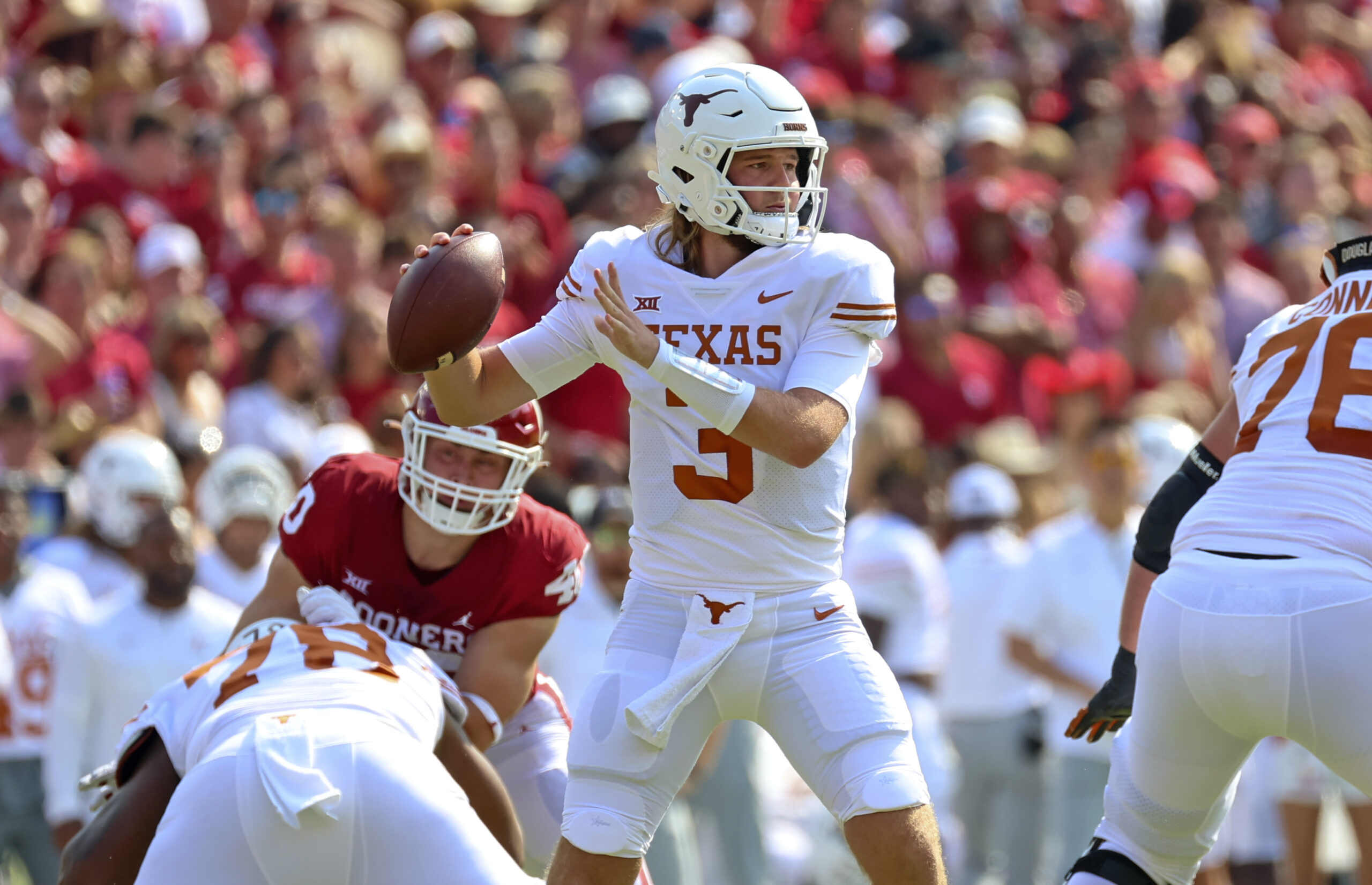 Oct 8, 2022; Dallas, Texas, USA; Texas Longhorns quarterback Quinn Ewers (3) throws during the first half against the Oklahoma Sooners at the Cotton Bowl.