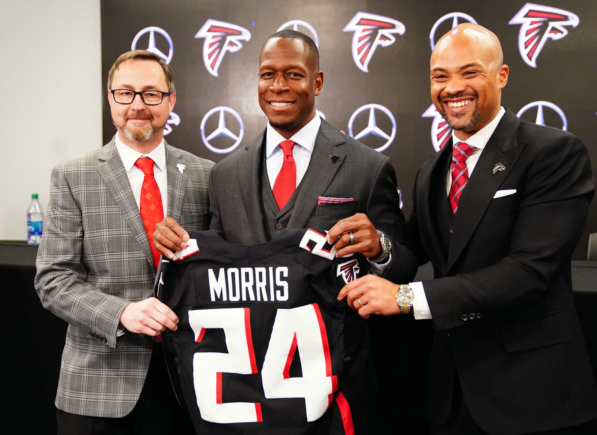 Feb 5, 2024; Atlanta, GA, USA; Falcons president Greg Beadles, head coach Raheem Morris and general manager Terry Fontenot of the Atlanta Falcons pose for the media after Morris is introduced as the head coach of the Atlanta Falcons at Mercedes-Benz Stadium.