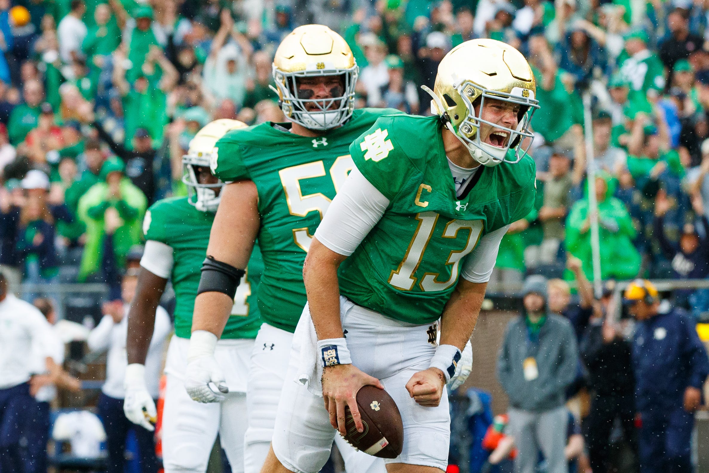 Notre Dame quarterback Riley Leonard (13) celebrates scoring a touchdown during a NCAA college football game between Notre Dame and Louisville at Notre Dame Stadium on Saturday, Sept. 28, 2024, in South Bend.