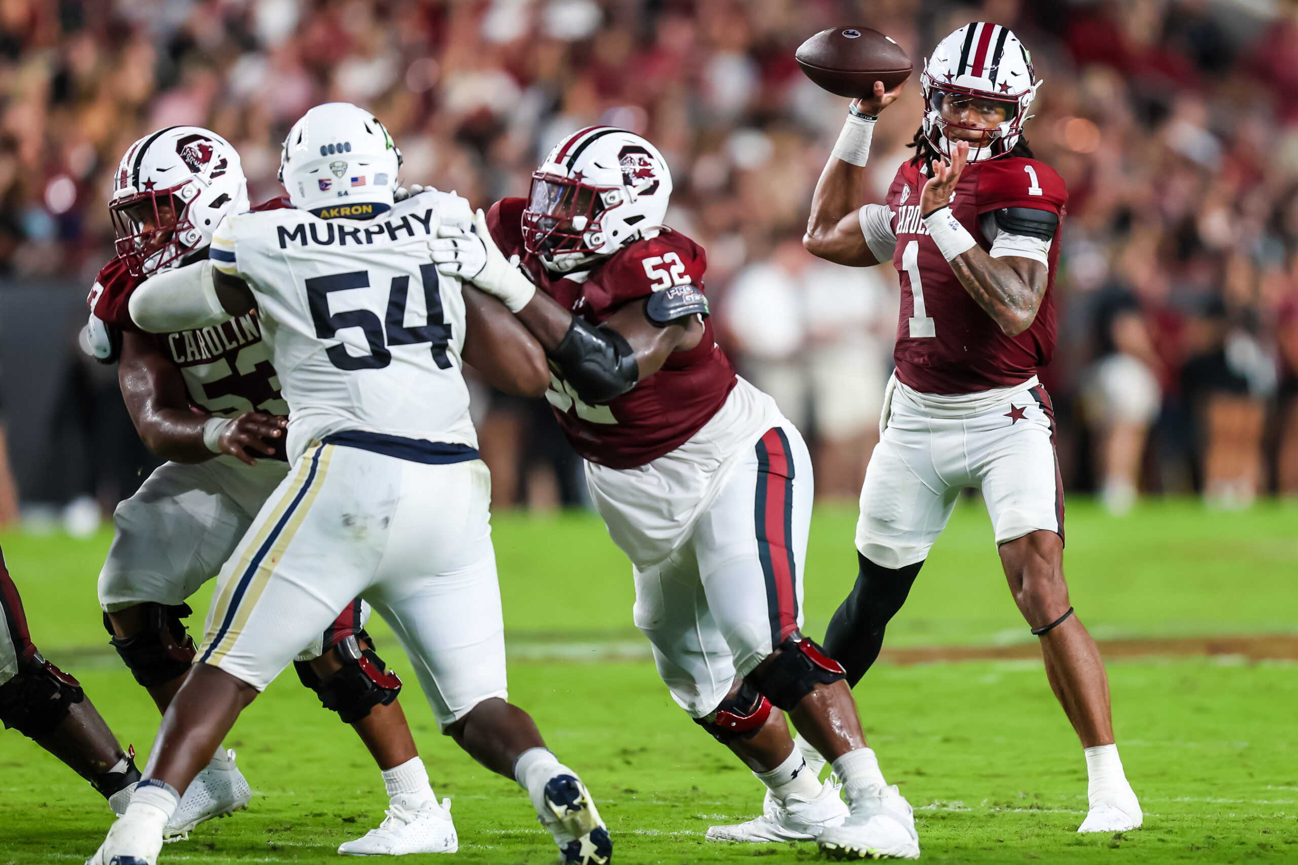 Sep 21, 2024; Columbia, South Carolina, USA; South Carolina Gamecocks quarterback Robby Ashford (1) passes against the Akron Zips in the second quarter at Williams-Brice Stadium.