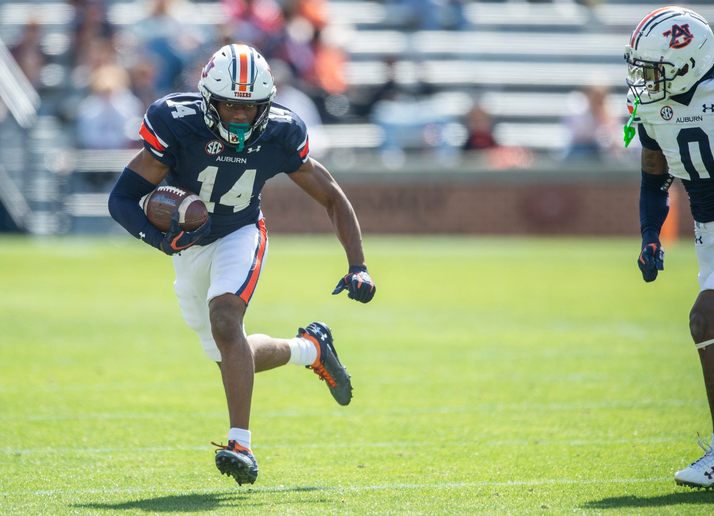 Auburn Tigers wide receiver Robert Lewis (14) turns up field after a catch during the A-Day spring game at Jordan-Hare Stadium in Auburn, Ala., on Saturday, April 6, 2024.