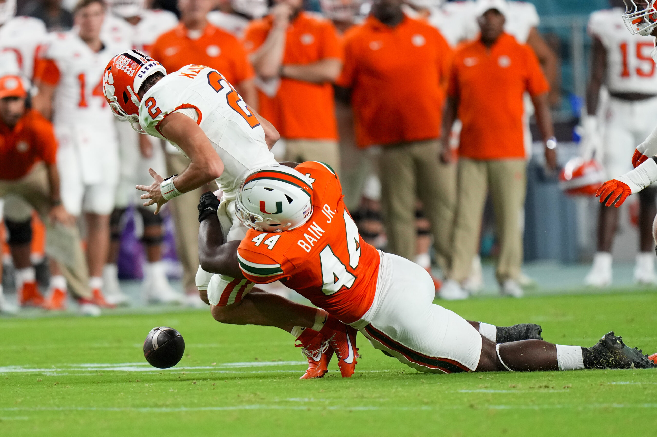 Oct 21, 2023; Miami Gardens, Florida, USA; Miami Hurricanes defensive lineman Rueben Bain Jr. (44) sacks Clemson Tigers quarterback Cade Klubnik (2) during the second quarter at Hard Rock Stadium. Mandatory Credit: Rich Storry-USA TODAY Sports