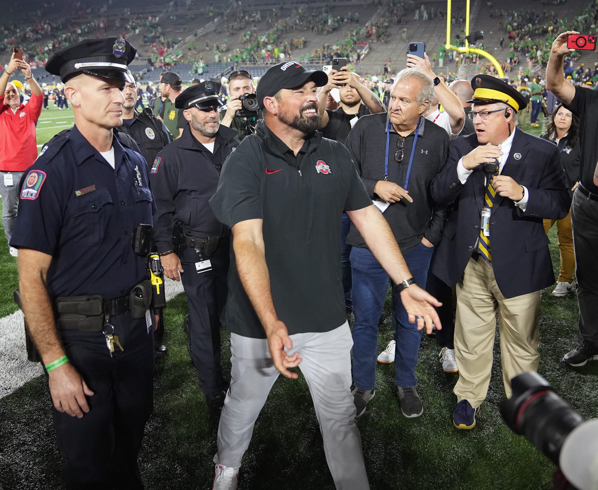 Sep 23, 2023; South Bend, Indiana, USA; Ohio State Buckeyes head coach Ryan Day celebrates towards the fans after beating Notre Dame Fighting Irish 17-14 at Notre Dame Stadium.