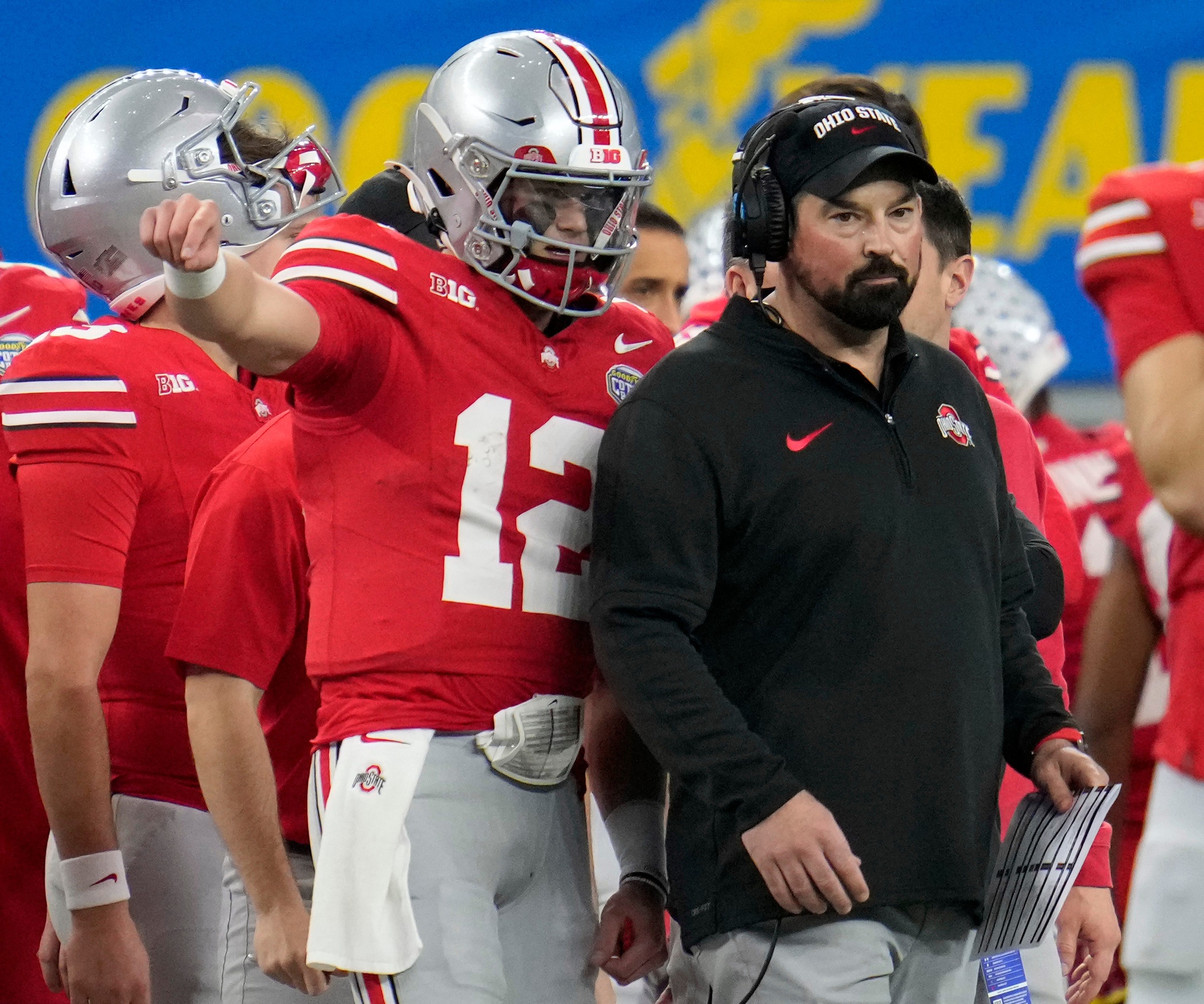 Dec 29, 2023; Arlington, Texas, USA; Ohio State Buckeyes quarterback Lincoln Kienholz (12) talks to Ohio State Buckeyes head coach Ryan Day in the third quarter against Missouri Tigers during the Goodyear Cotton Bowl Classic at AT&T Stadium.