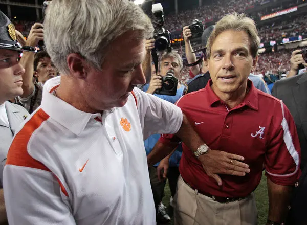 Tommy Bowden and Nick Saban meet after the Chick-Fil-A Kickoff game in Atlanta, Georgia