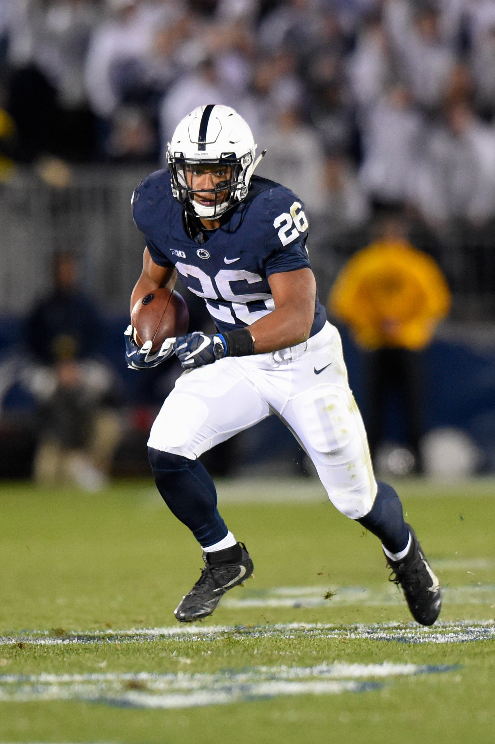 Nov 5, 2016; University Park, PA, USA; Penn State Nittany Lions running back Saquon Barkley (26) runs with the ball against the Iowa Hawkeyes during the third quarter at Beaver Stadium. Penn State defeated Iowa 41-14. 