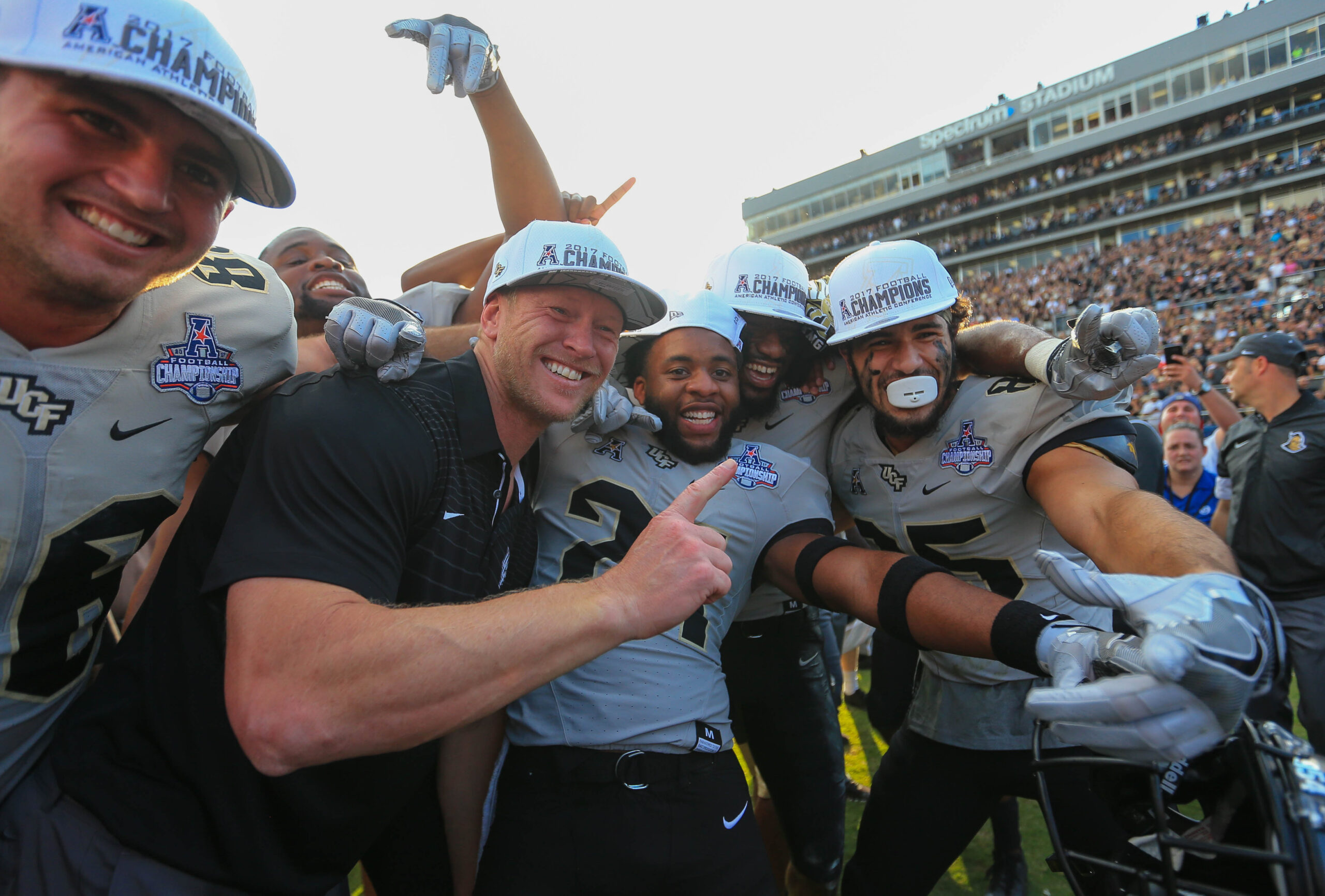 Dec 2, 2017; Orlando, FL, USA; UCF Knights head coach Scott Frost celebrates with players after defeating the Memphis Tigers in double overtime at Spectrum Stadium.