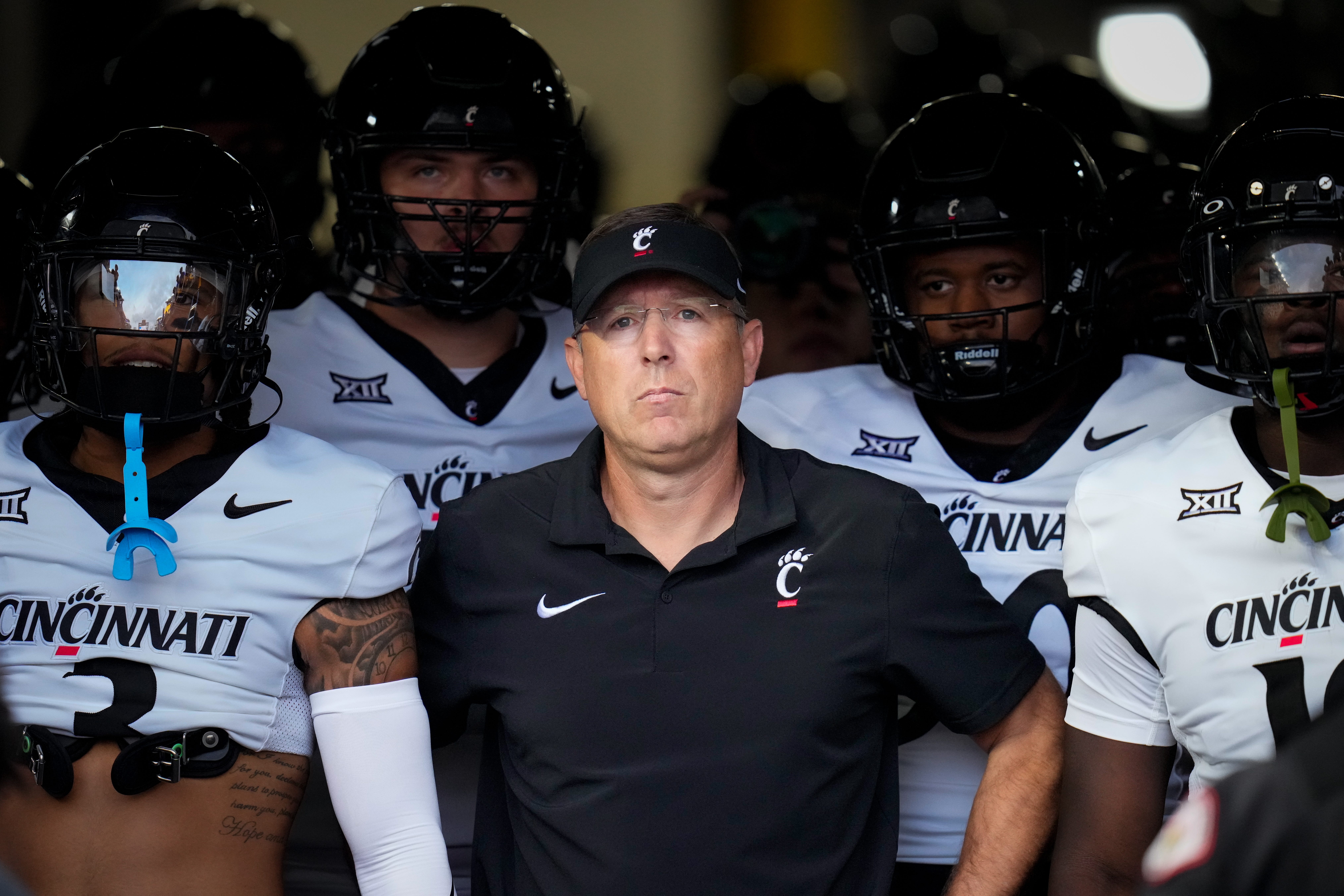Cincinnati Bearcats head coach Scott Satterfield leads the Bearcats onto the field for the first quarter of the NCAA football game between the Pittsburgh Panthers and the Cincinnati Bearcats at Acrisure Stadium in Pittsburgh on Saturday, Sept. 9, 2023. The Bearcats led 20-7 at halftime.