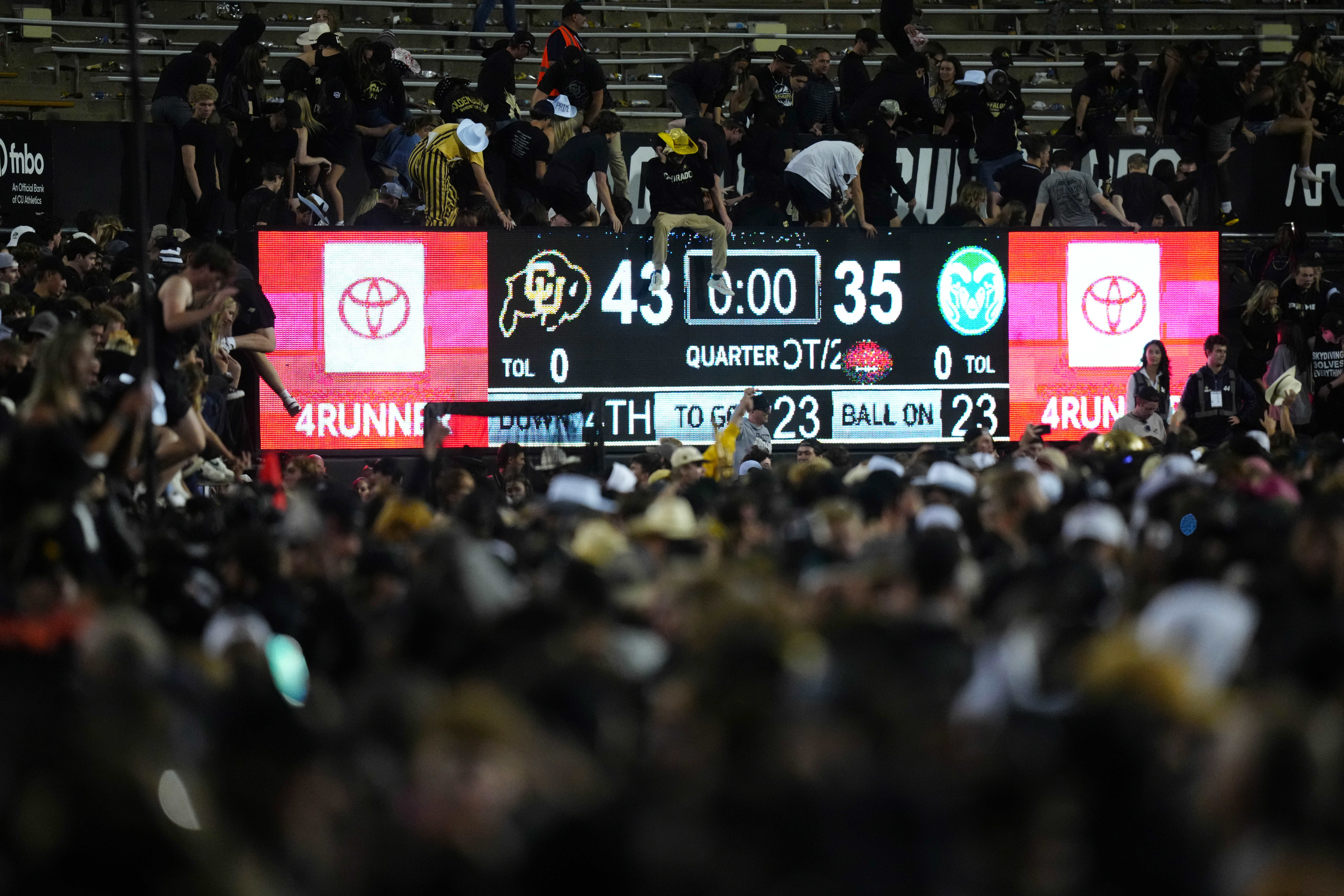 Sep 16, 2023; Boulder, Colorado, USA; Colorado Buffaloes fans rush Folsom Field following the double overtime win against the Colorado State Rams.