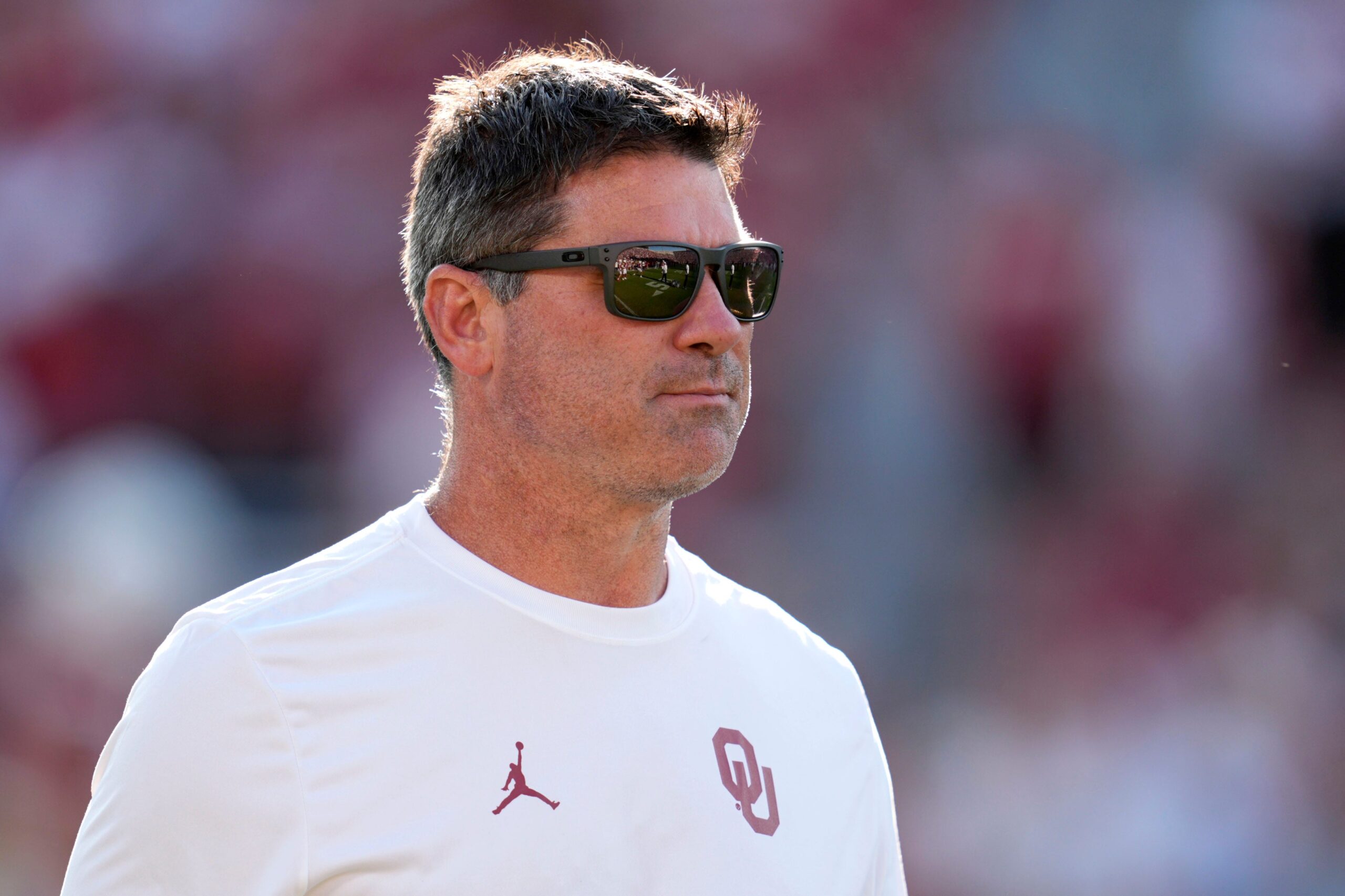 Oklahoma offensive coordinator Seth Littrell walks on the field before a college football game between the University of Oklahoma Sooners (OU) and the Houston Cougars at Gaylord Family – Oklahoma Memorial Stadium in Norman, Okla., Saturday, Sept. 7, 2024.