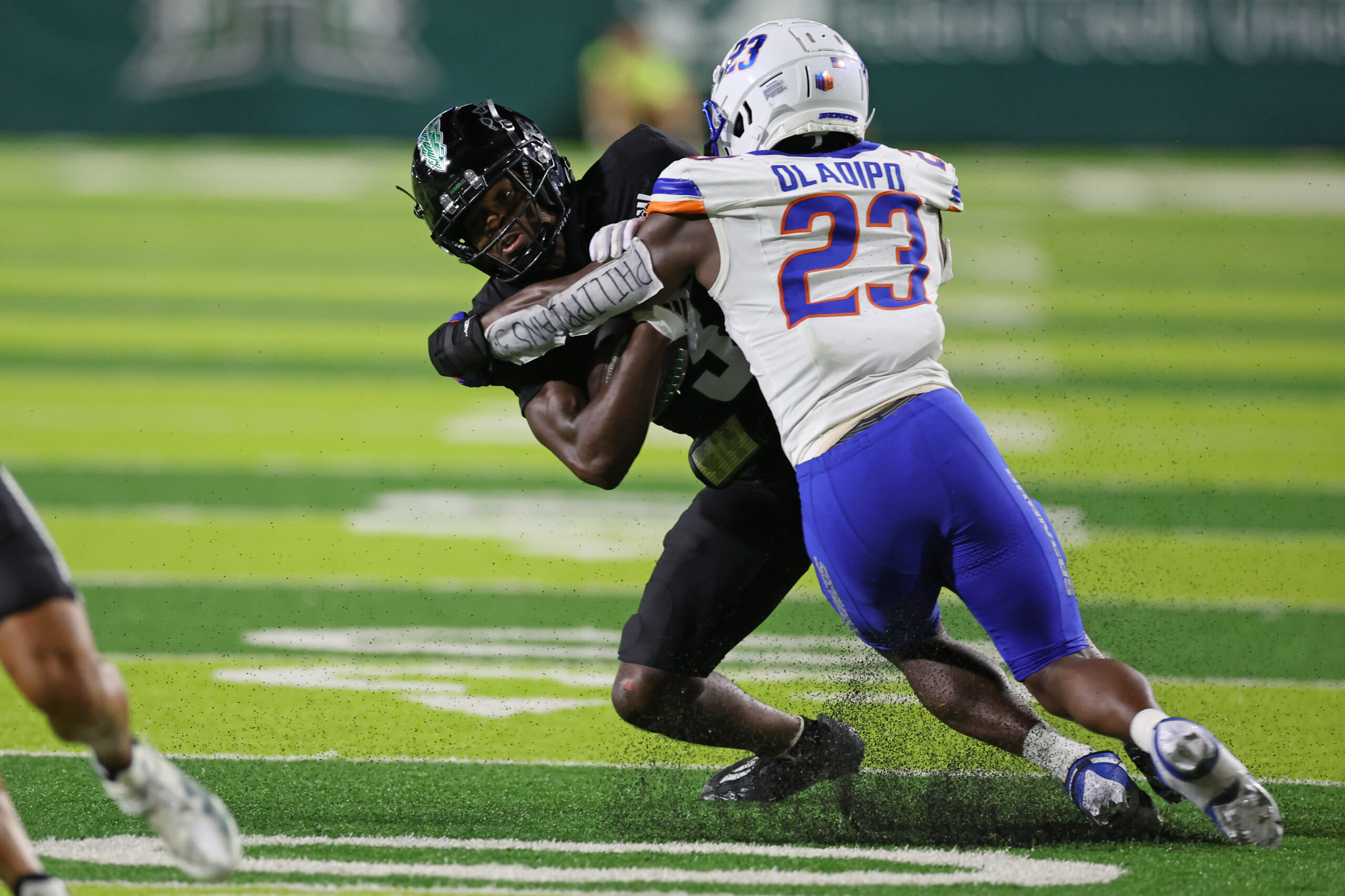 Oct 12, 2024; Honolulu, Hawaii, USA; Boise State Broncos safety Seyi Oladipo (23) tackles Hawaii Rainbow Warriors wide receiver Nick Cenacle (3) during the fourth quarter of a NCAA college football game at Clarence T.C. Ching Athletics Complex. 