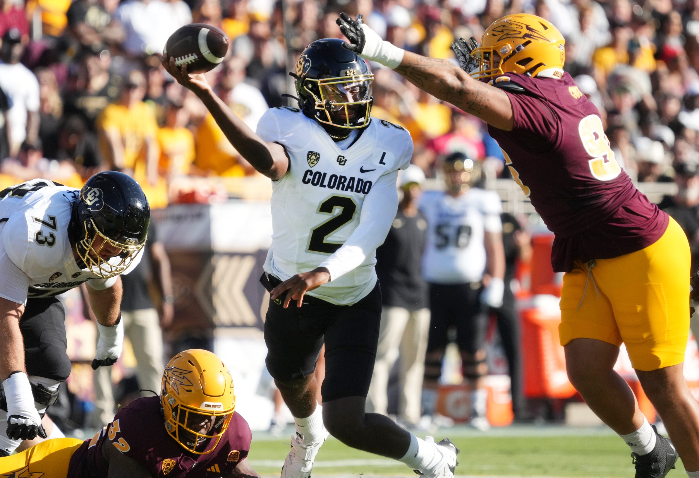 Oct 7, 2023; Tempe, Arizona, USA; ASU Sun Devils defensive lineman Anthonie Cooper (96) tries to block the pass of Colorado Buffaloes quarterback Shedeur Sanders (2) at Mountain America Stadium.