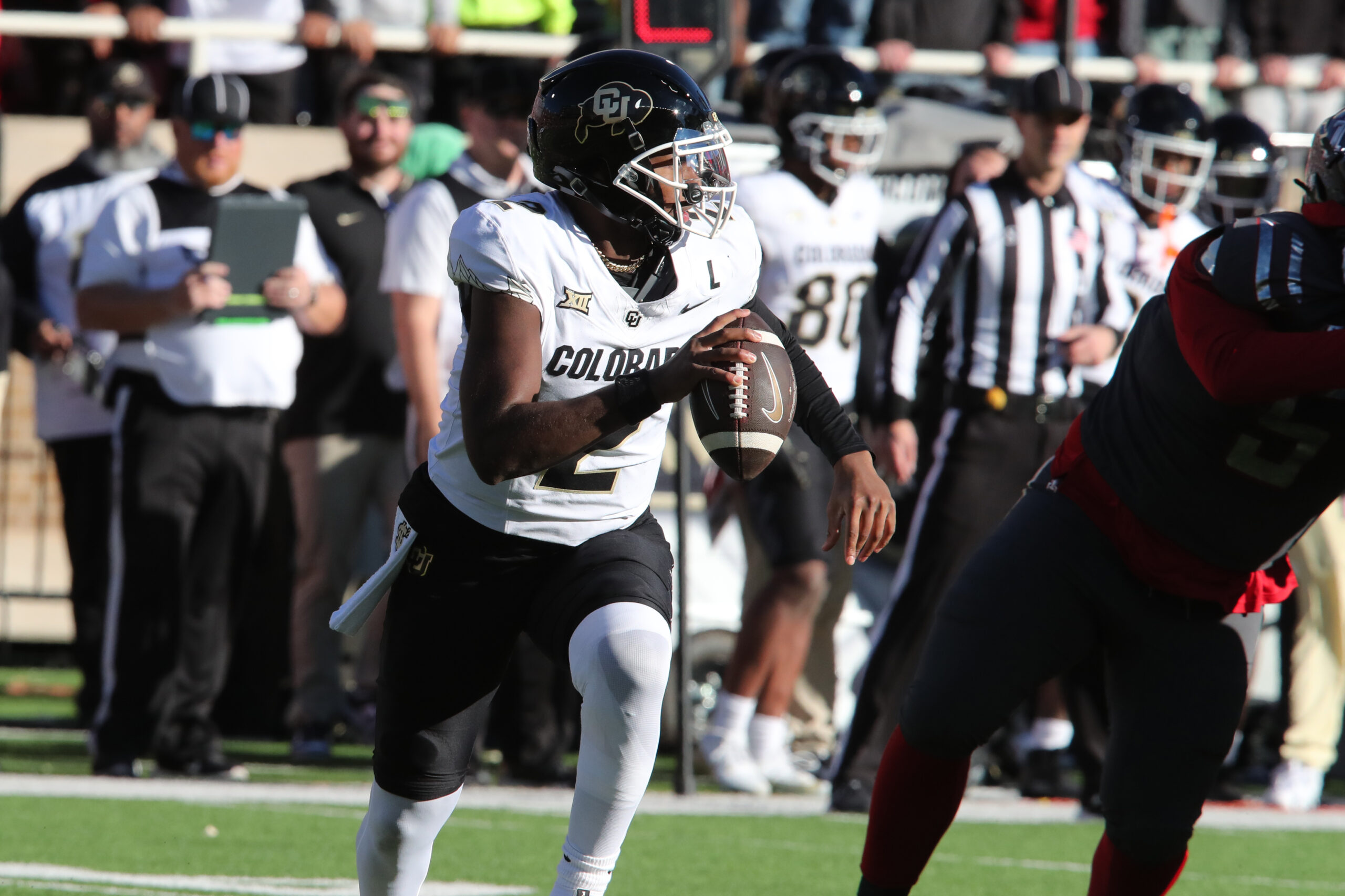 Nov 9, 2024; Lubbock, Texas, USA; Colorado Buffalos quarterback Shedeur Sanders (2) scrambles in the first half against the Texas Tech Red Raiders at Jones AT&T Stadium and Cody Campbell Field.