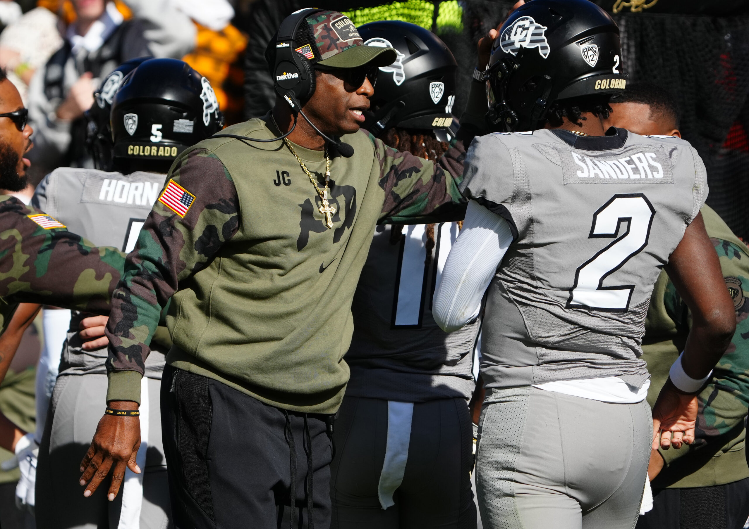 Nov 11, 2023; Boulder, Colorado, USA; Colorado Buffaloes quarterback Shedeur Sanders (2) celebrates his touchdown with head coach Deion Sanders in the first half against the Arizona Wildcats at Folsom Field.