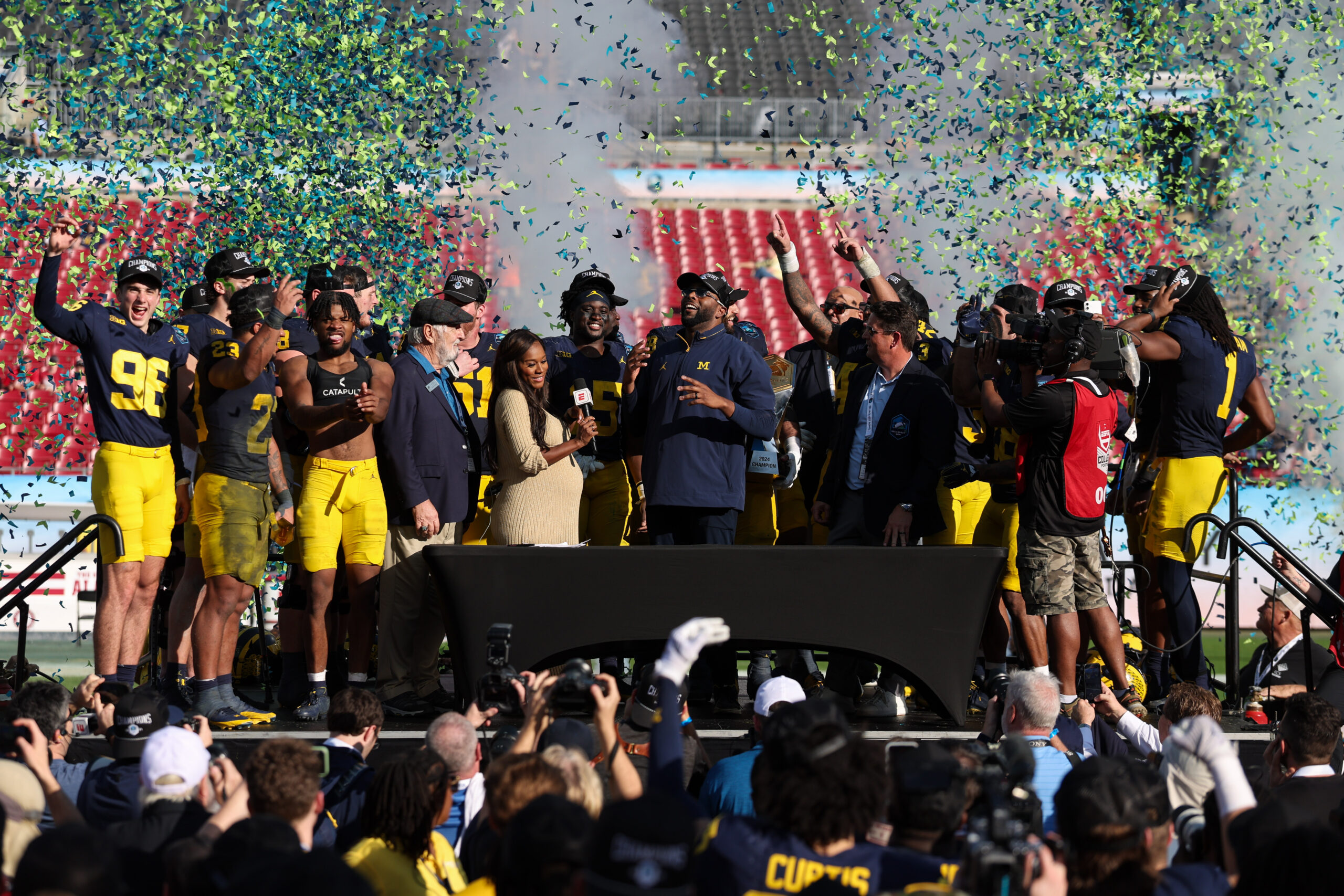 Dec 31, 2024; Tampa, FL, USA; Michigan Wolverines head coach Sherrone Moore celebrates after beating the Alabama Crimson Tide in the ReliaQuest Bowl at Raymond James Stadium.