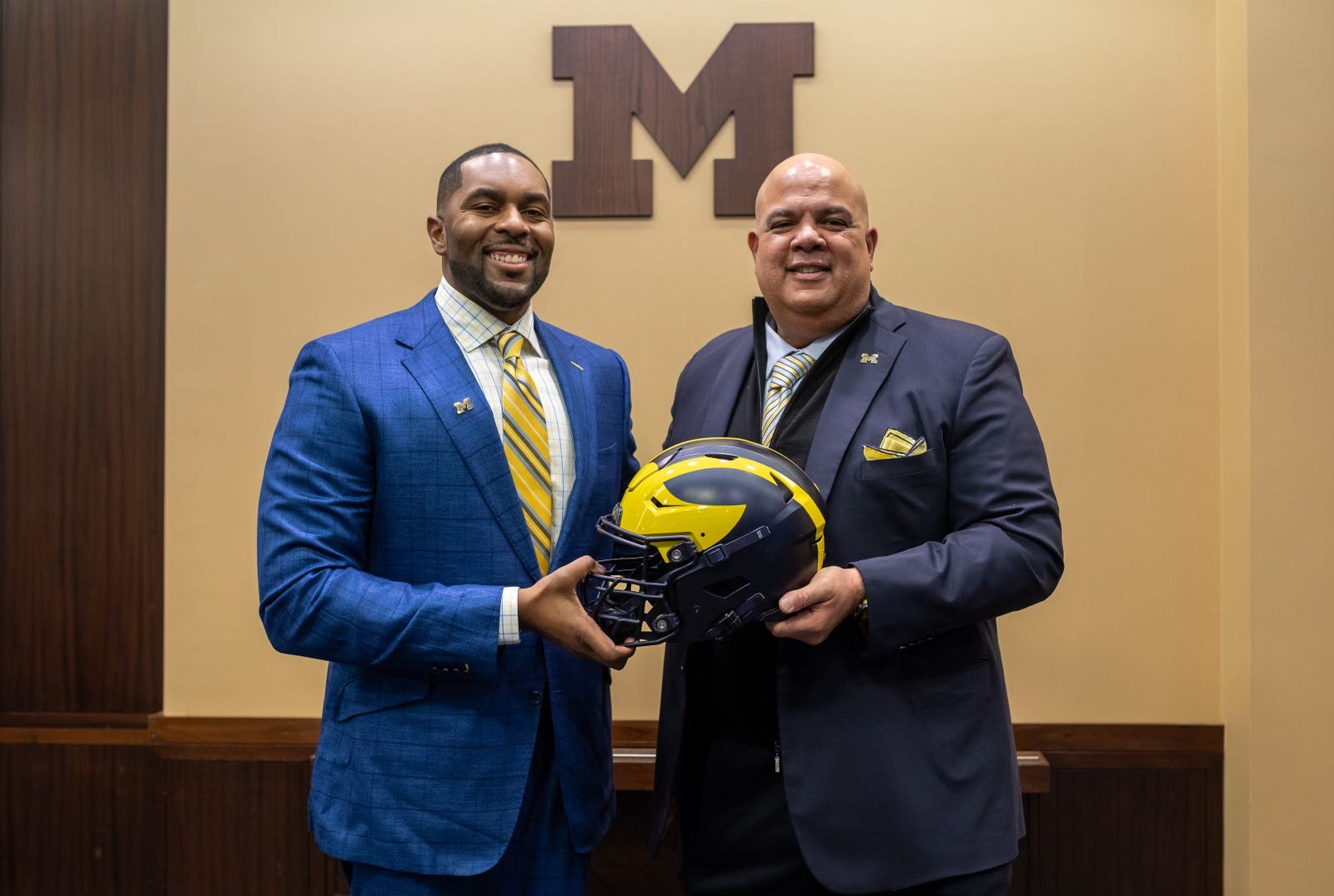 Sherrone Moore, head coach of the University of Michigan, stands next to Warde Manuel, Michigan s Director of Athletics, during a press conference inside the Junge Family Champions Center in Ann Arbor on Saturday, Jan. 27, 2024.