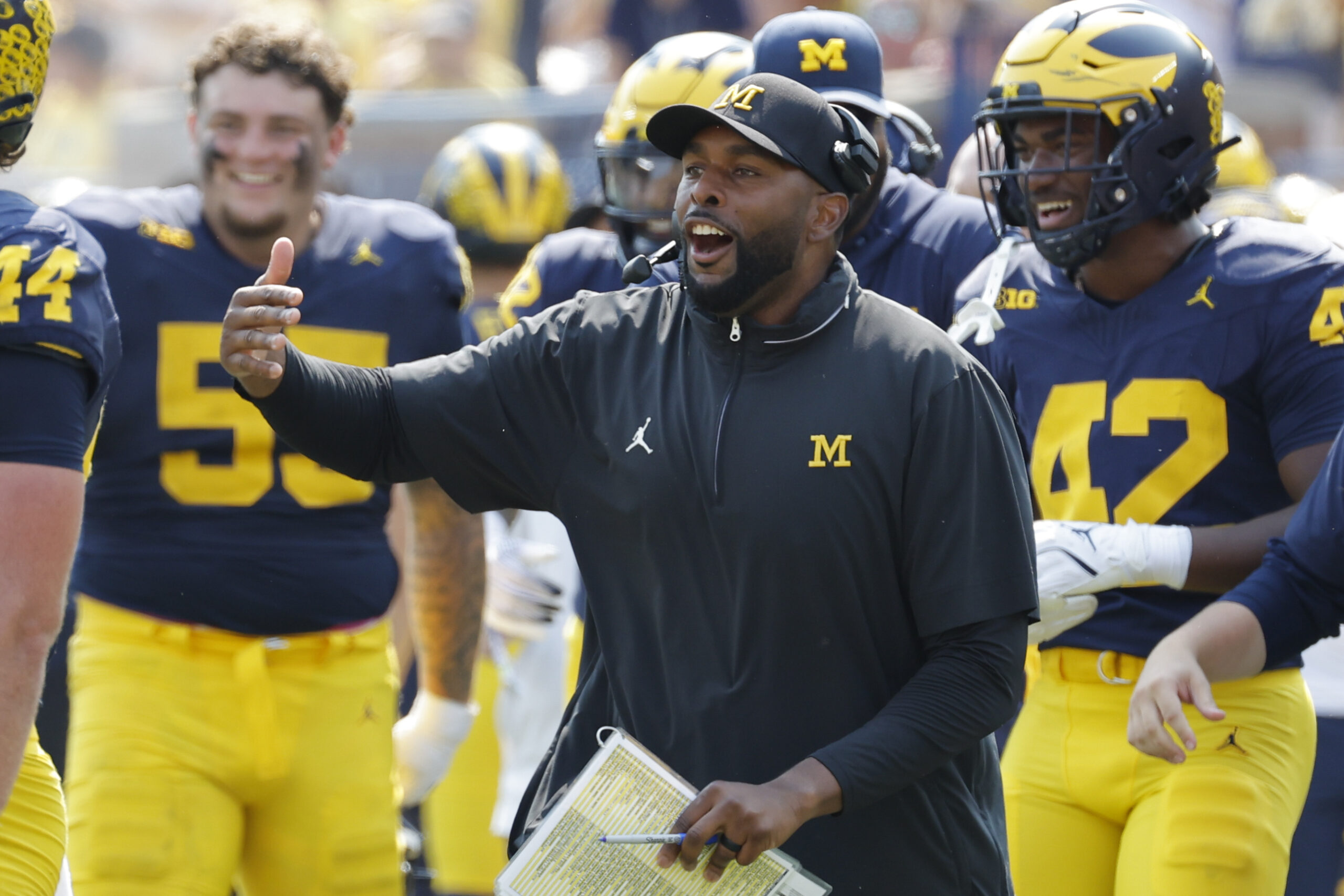 Sep 14, 2024; Ann Arbor, Michigan, USA; Michigan Wolverines head coach Sherrone Moore reacts on the sideline during the second half against the Arkansas State Red Wolves at Michigan Stadium. 