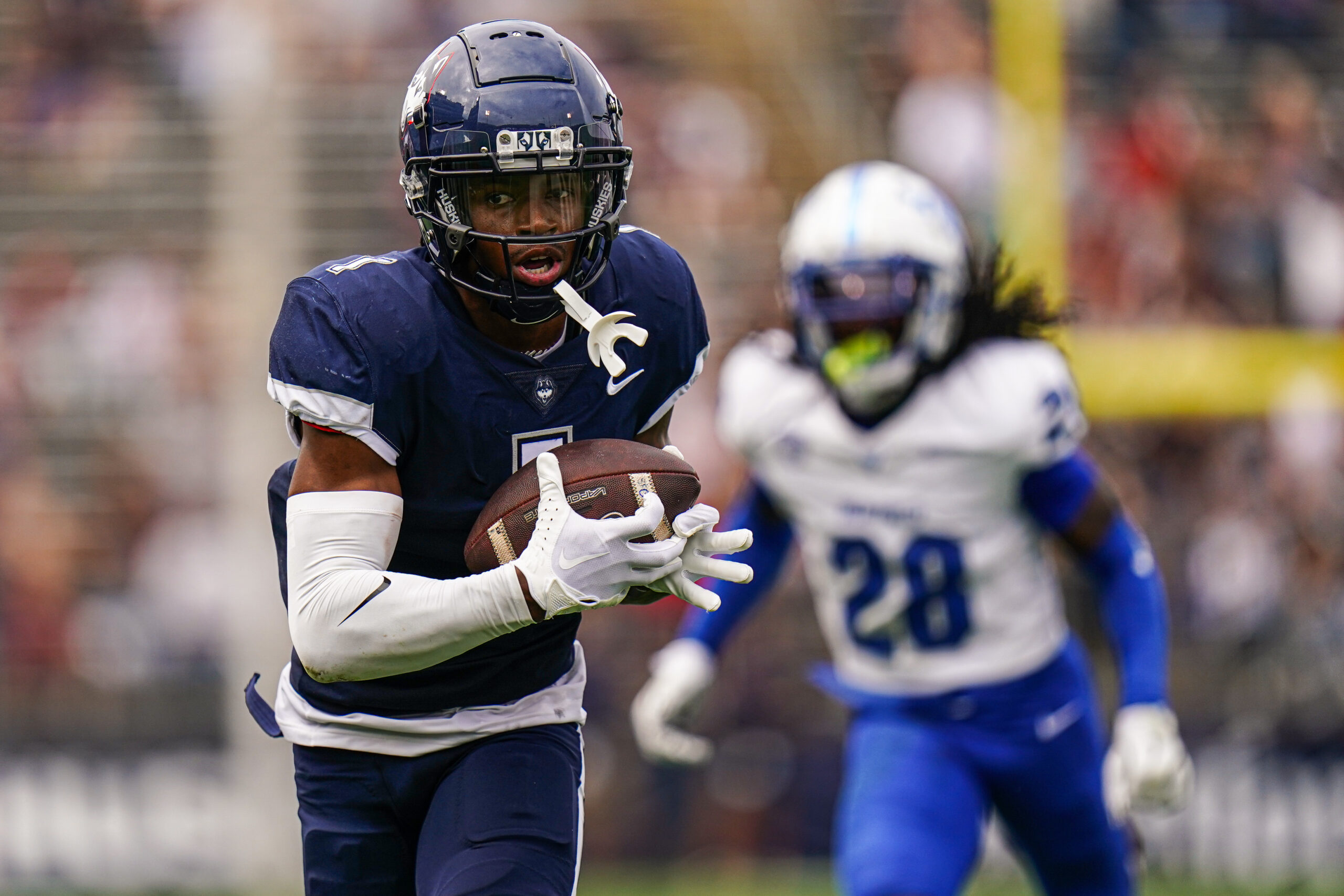 Sep 28, 2024; East Hartford, Connecticut, USA; Connecticut Huskies wide receiver Skyler Bell (1) makes the touchdown catch against the Buffalo Bulls in the second quarter at Rentschler Field at Pratt & Whitney Stadium.