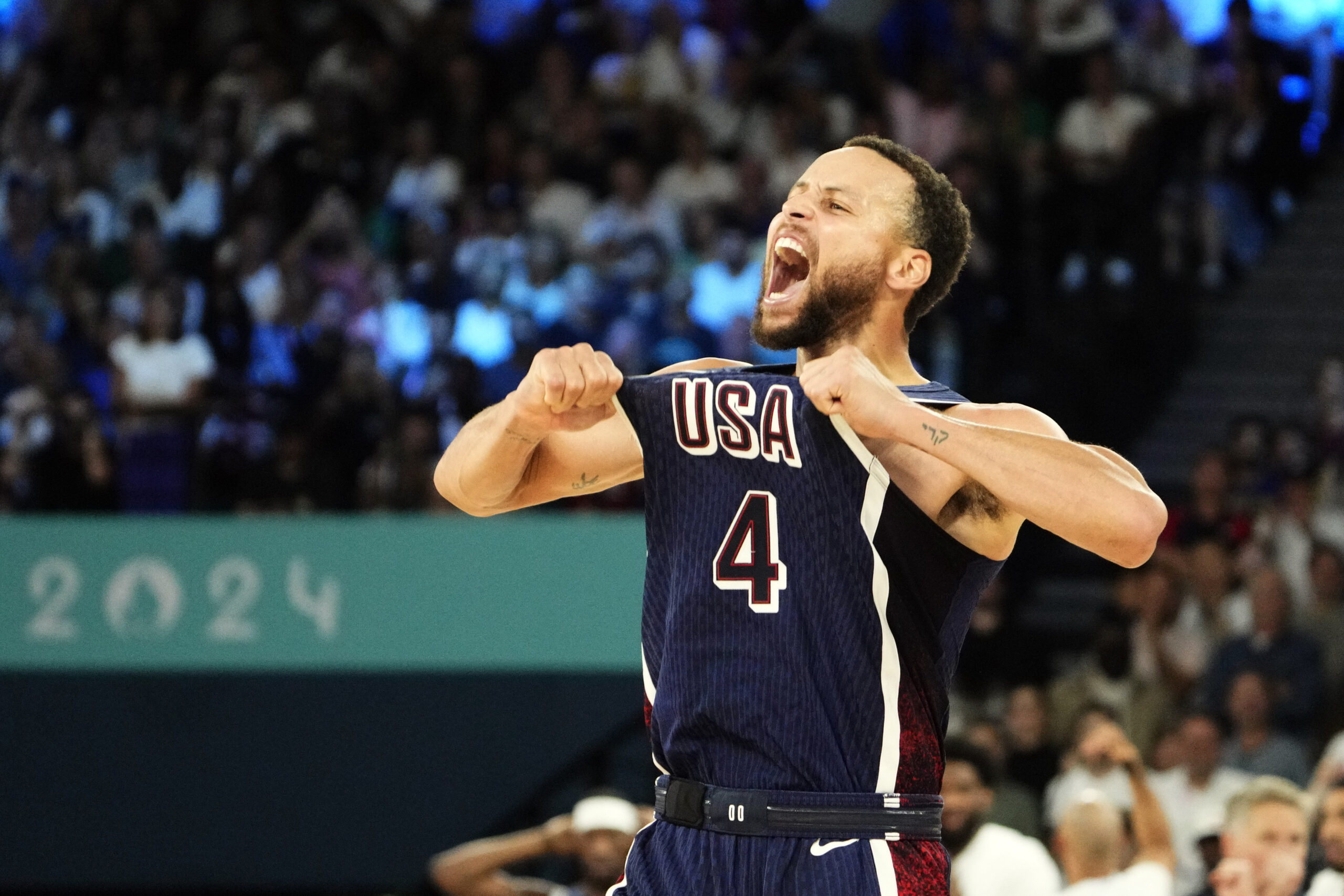 Aug 10, 2024; Paris, France; United States shooting guard Stephen Curry (4) celebrates in the second half against France in the men's basketball gold medal game during the Paris 2024 Olympic Summer Games at Accor Arena.