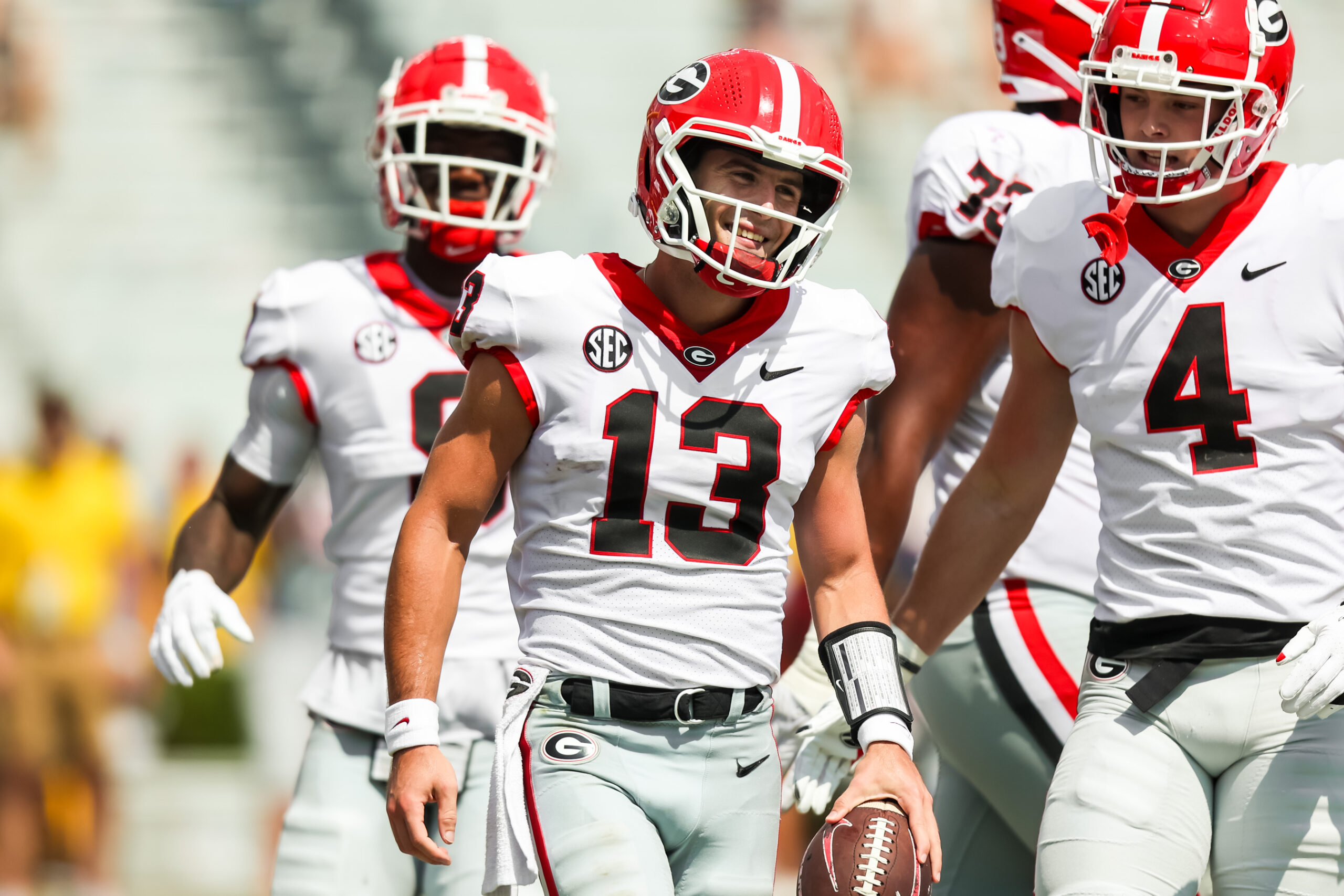 Sep 17, 2022; Columbia, South Carolina, USA; Georgia Bulldogs quarterback Stetson Bennett (13) and Georgia Bulldogs tight end Oscar Delp (4) celebrate a touchdown run by Bennett against the South Carolina Gamecocks in the second half at Williams-Brice Stadium.