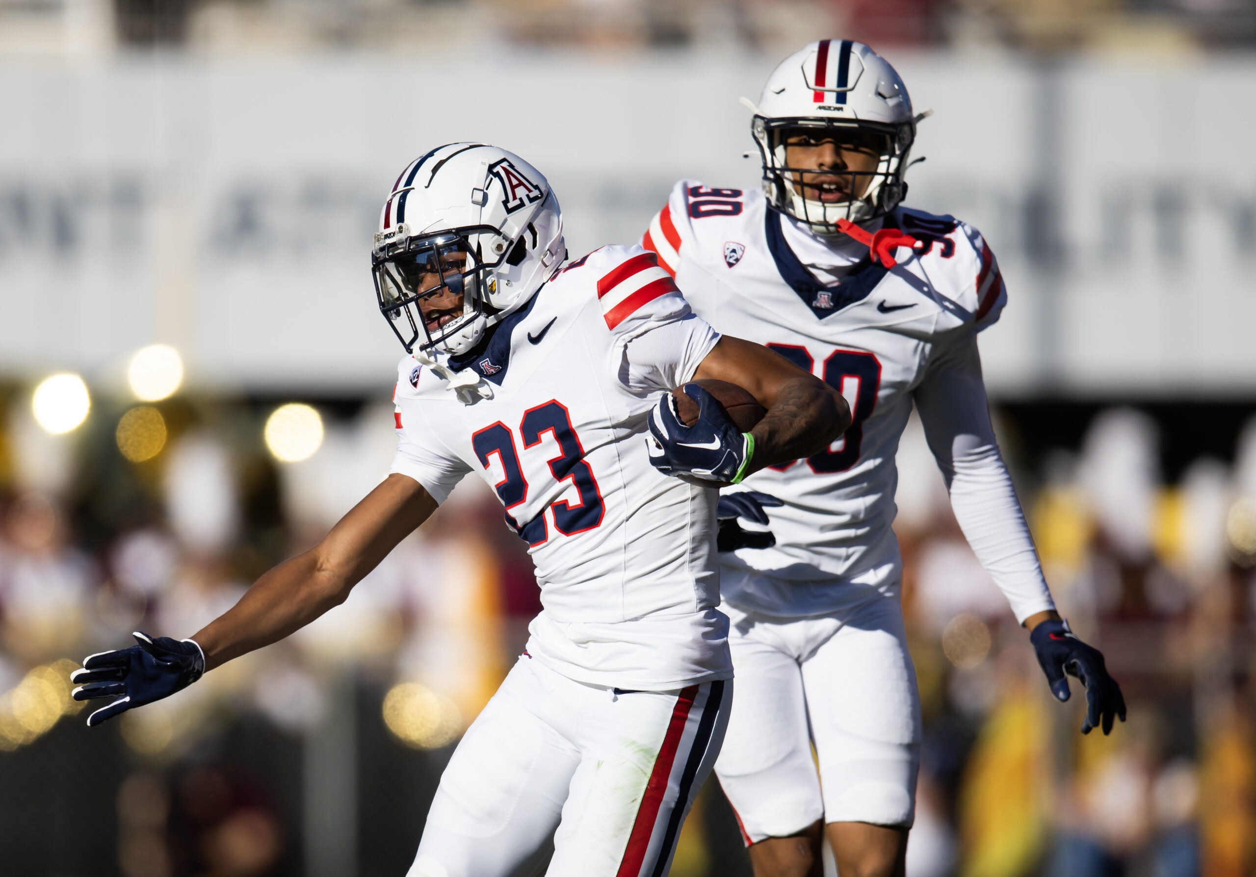 Nov 25, 2023; Tempe, Arizona, USA; Arizona Wildcats cornerback Tacario Davis (23) returns a fumble against the Arizona State Sun Devils in the first half of the Territorial Cup at Mountain America Stadium