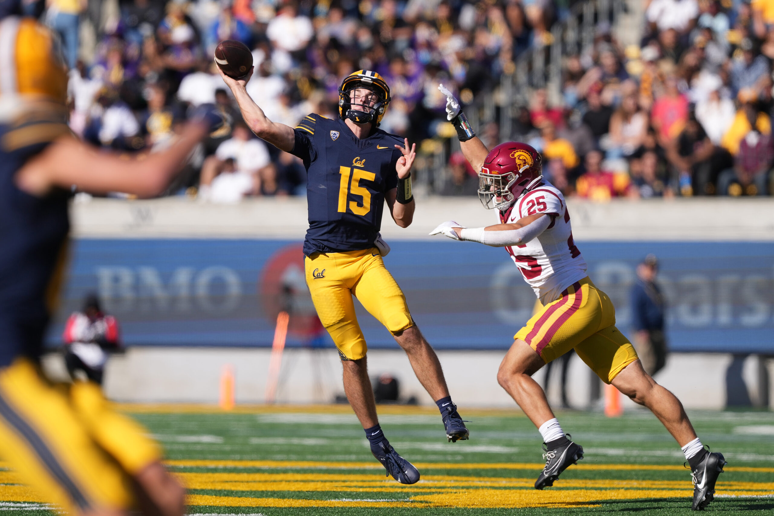 Oct 28, 2023; Berkeley, California, USA; California Golden Bears quarterback Fernando Mendoza (15) throws a pass against USC Trojans linebacker Tackett Curtis (25) during the second quarter at California Memorial Stadium.