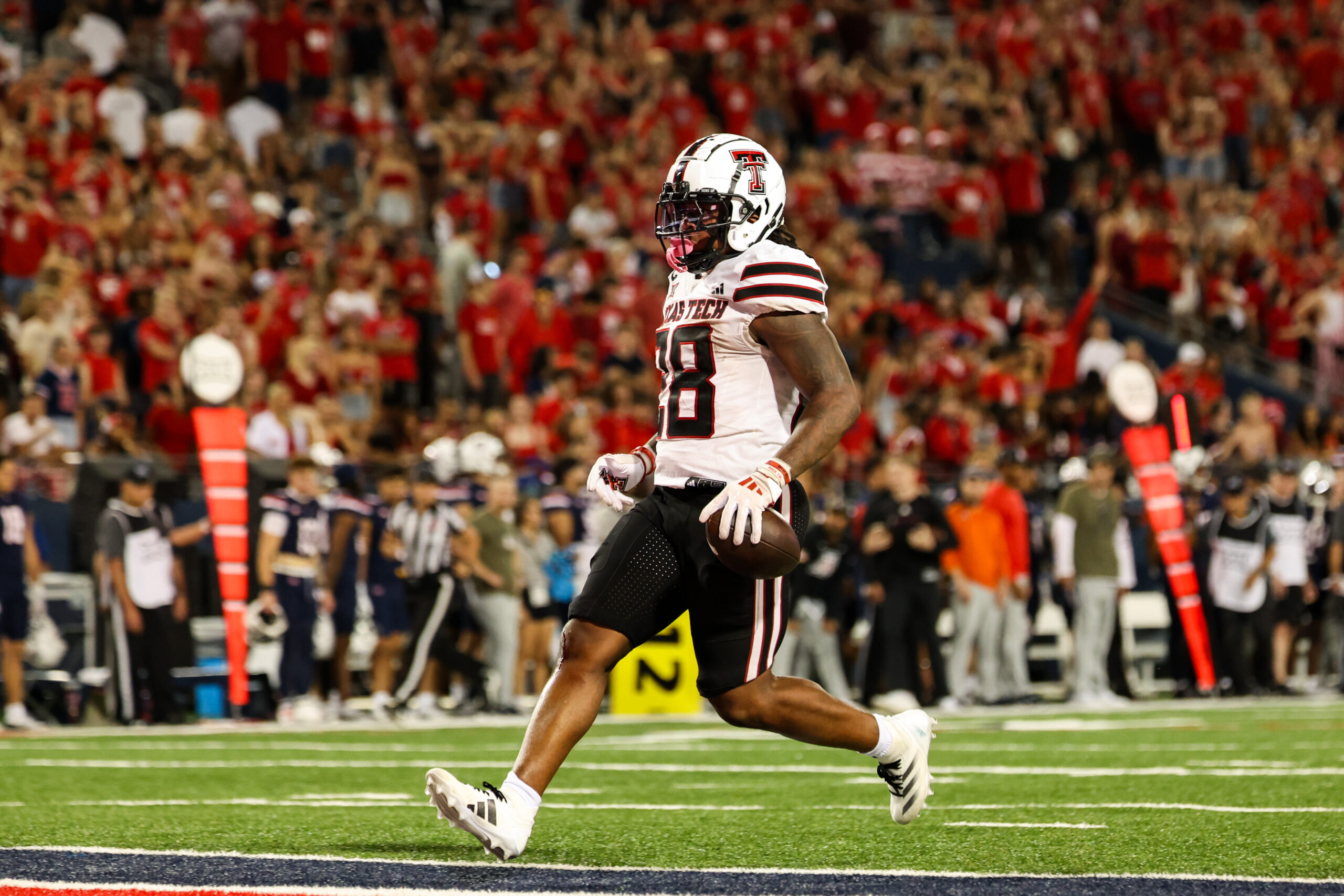 Dec 28, 2022; Houston, Texas, USA; Texas Tech Red Raiders running back Tahj Brooks (28) runs with the ball as Mississippi Rebels cornerback Miles Battle (6) defends during the first quarter in the 2022 Texas Bowl at NRG Stadium.