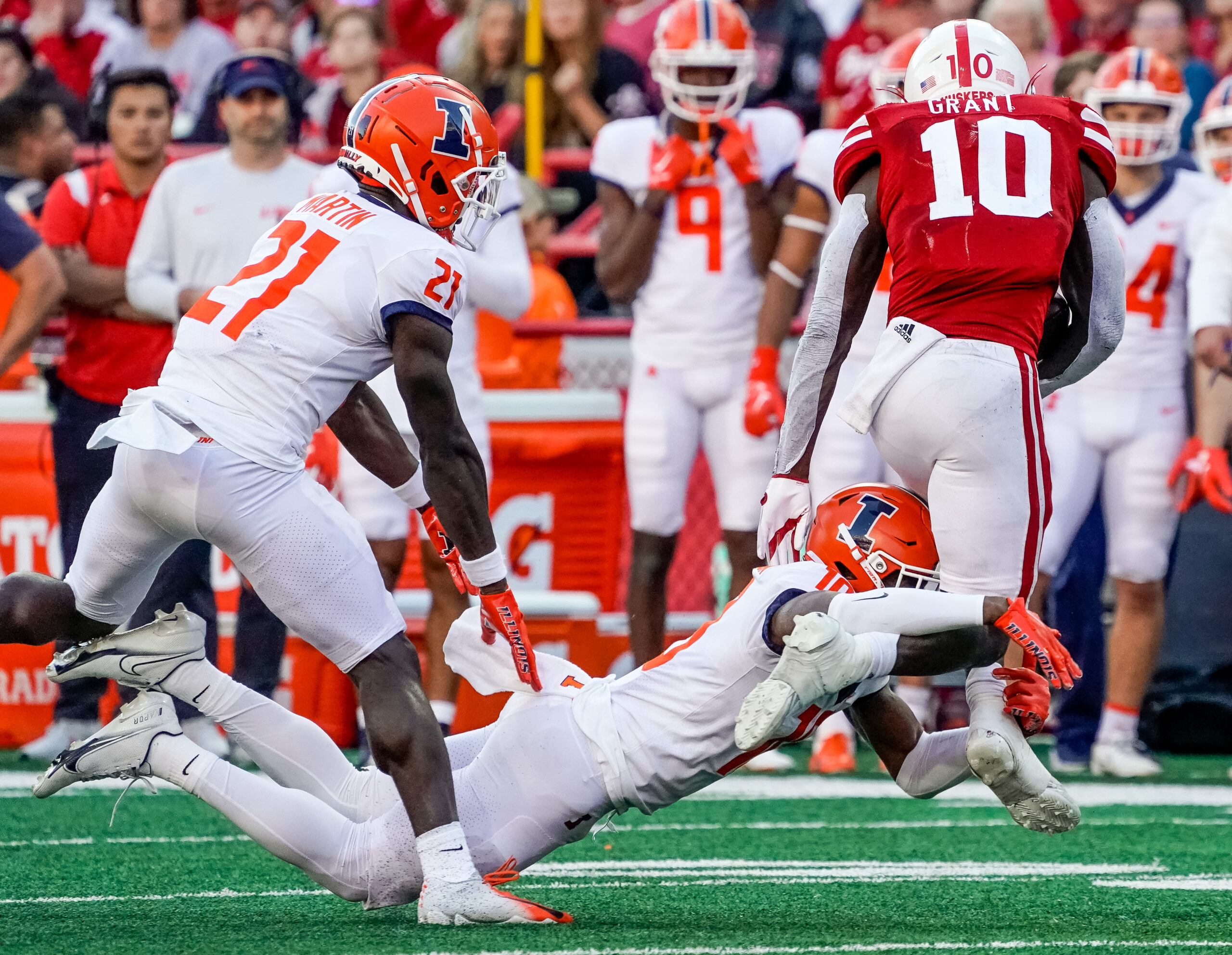 Oct 29, 2022; Lincoln, Nebraska, USA; Illinois Fighting Illini defensive back Tahveon Nicholson (10) tackles Nebraska Cornhuskers running back Anthony Grant (10) during the third quarter at Memorial Stadium.