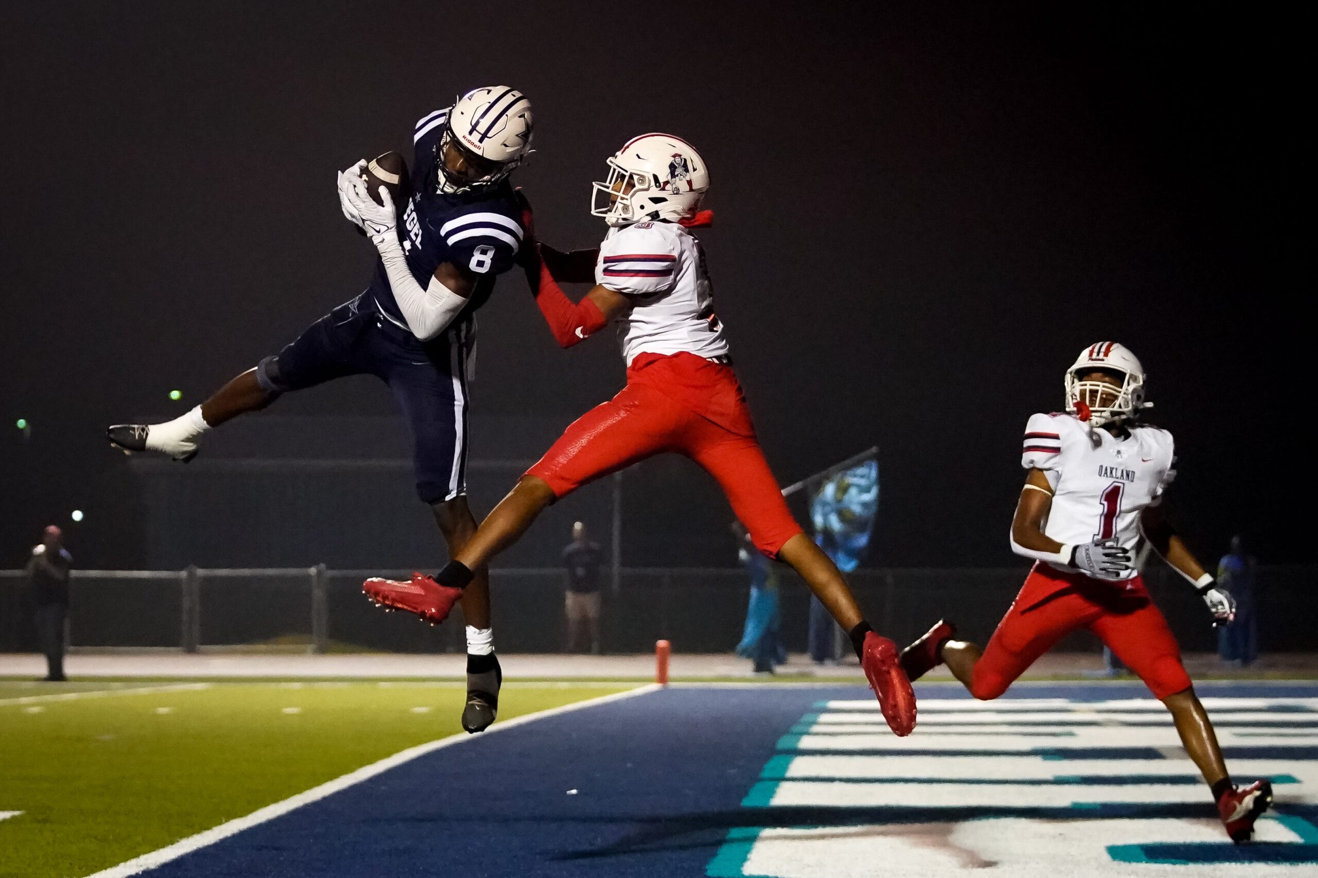 Siegel's Tarrion Grant (8) brings in a touchdown over Oakland's Gus Ramsey (3) during the second quarter at Siegel High School in Murfreesboro, Tenn., Thursday, Sept. 28, 2023.