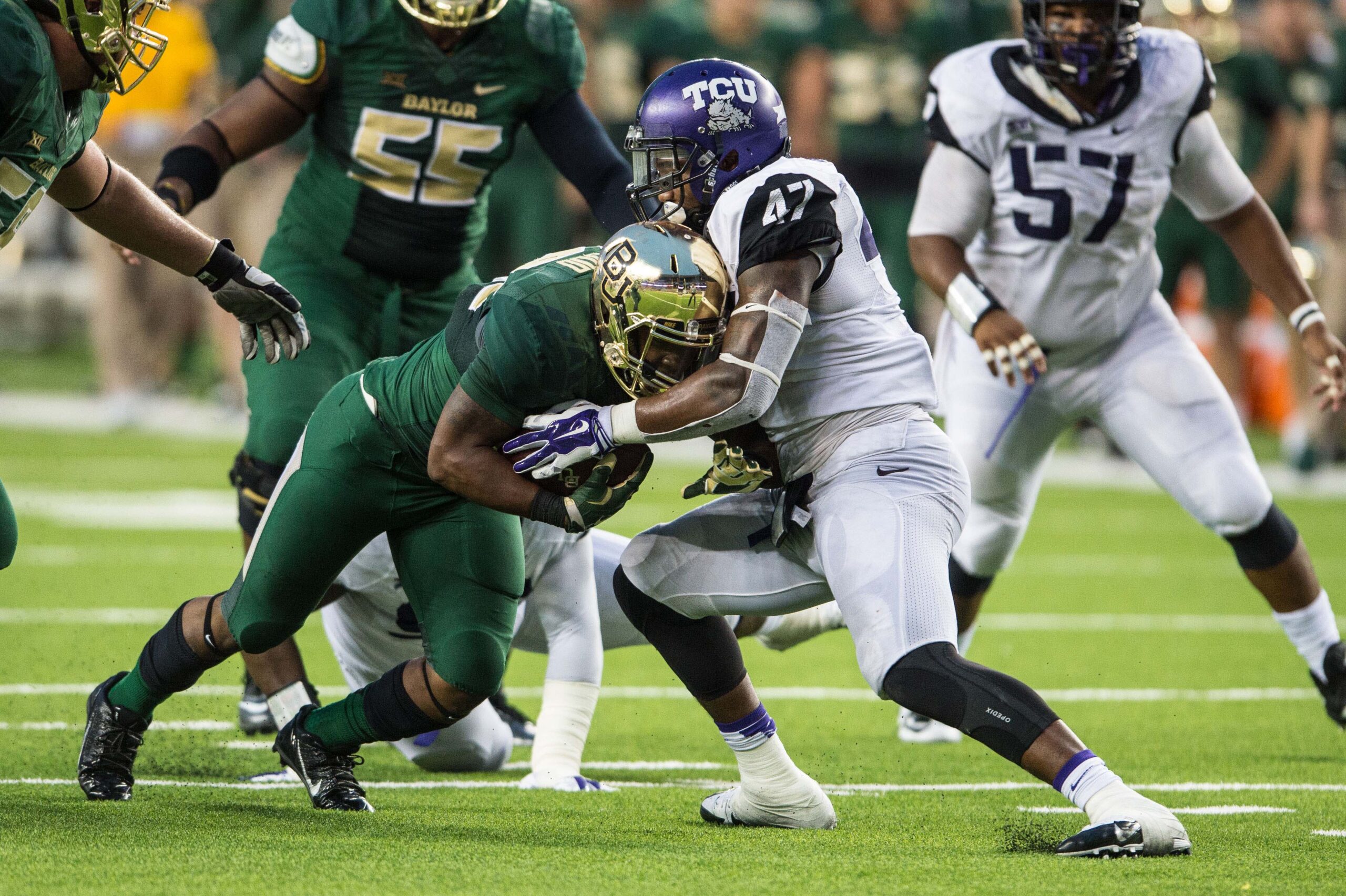 Oct 11, 2014; Waco, TX, USA; TCU Horned Frogs linebacker Paul Dawson (47) tackles Baylor Bears running back Shock Linwood (32) during the game at McLane Stadium. The Bears defeat Horned Frogs 61-58.