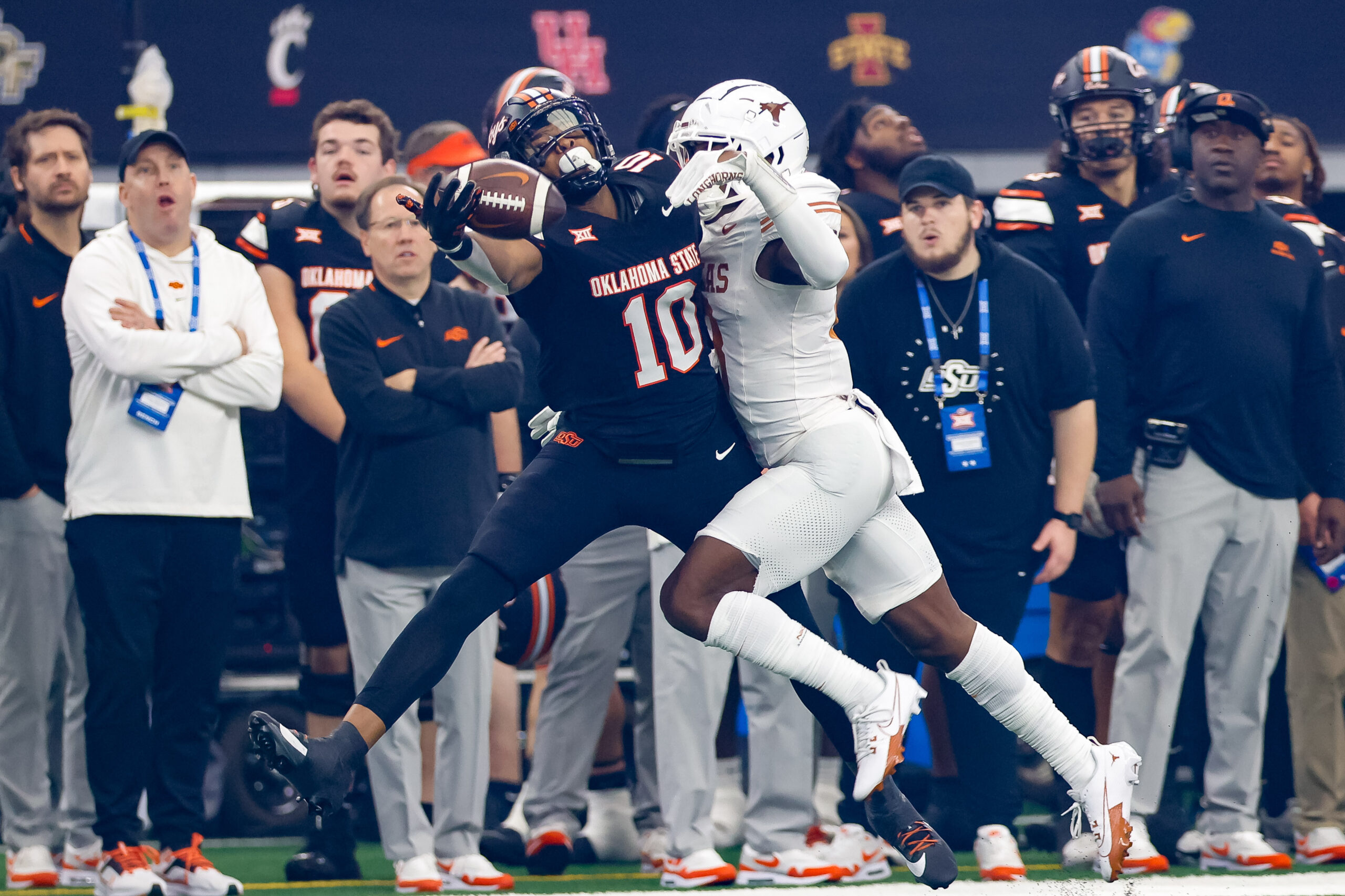 Dec 2, 2023; Arlington, TX, USA; Texas Longhorns defensive back Terrance Brooks (8) breaks up a pass intended for Oklahoma State Cowboys wide receiver Rashod Owens (10) during the first quarter at AT&T Stadium.
