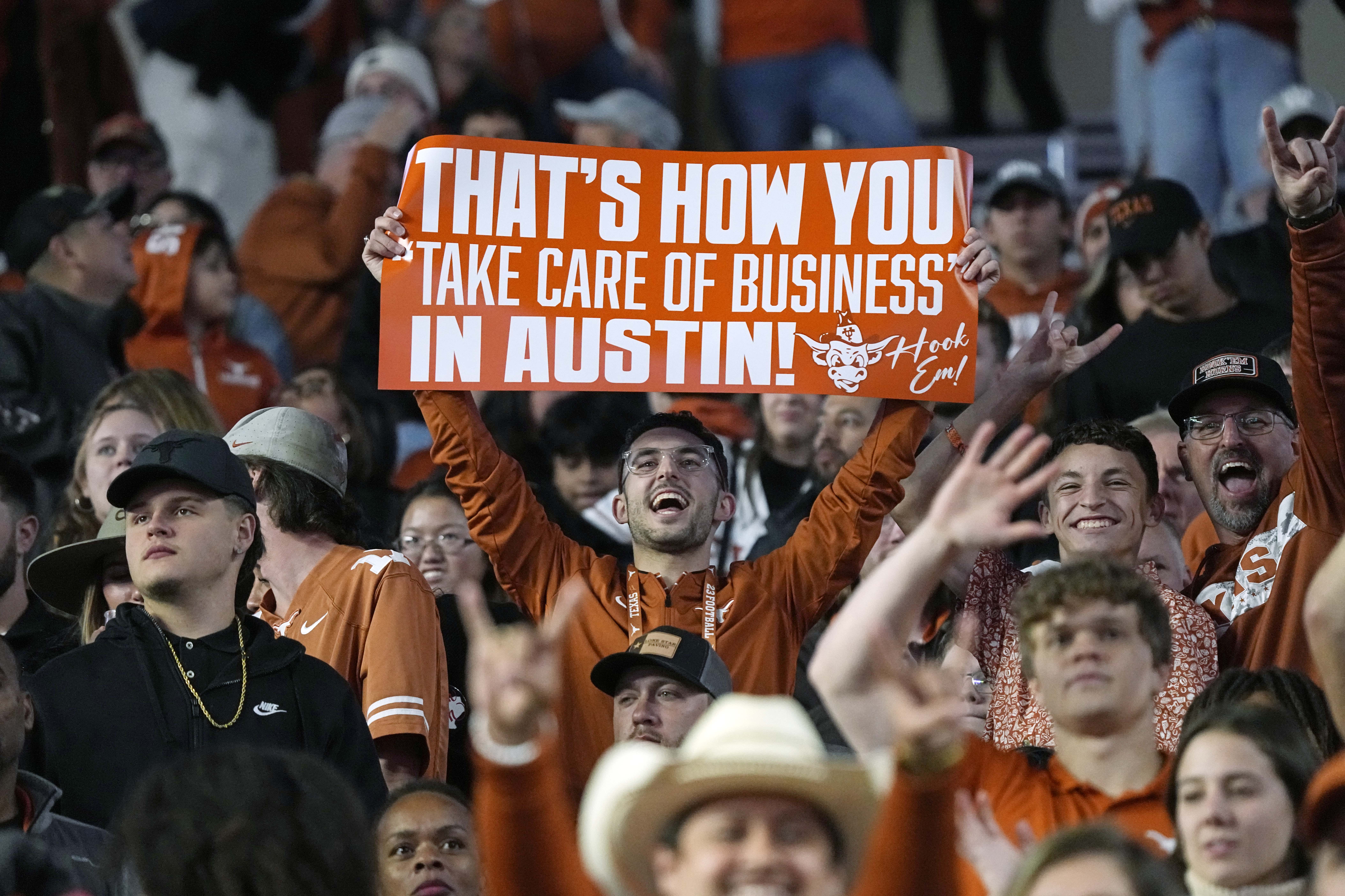 Nov 24, 2023; Austin, Texas, USA; Texas Longhorns fans holds up a sign after a victory over the Texas Tech Red Raiders at Darrell K Royal-Texas Memorial Stadium.
