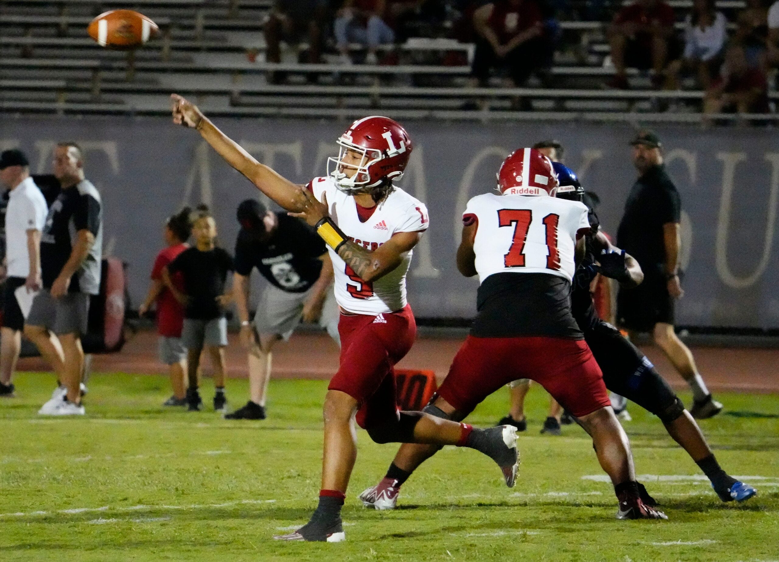 Orange Lutheran Lancers quarterback TJ Lateef (9) throws a pass against the Chandler Wolves during a football game at Chandler High in Chandler on Sept. 8, 2023.