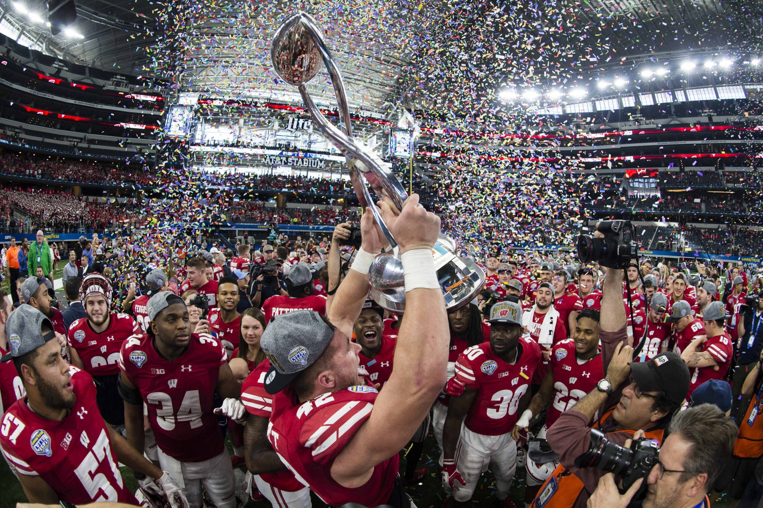 Jan 2, 2017; Arlington, TX, USA; Wisconsin Badgers linebacker T.J. Watt (42) holds up the Cotton Bowl trophy after defeating the Western Michigan Broncos 24-16 at AT&T Stadium.