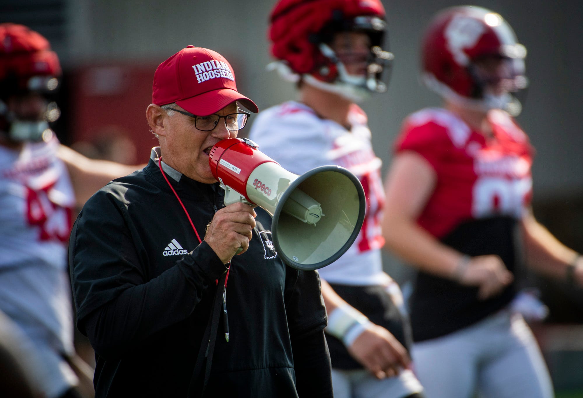 Indiana Head Coach Tom Allen uses his megaphone during Indiana football fall camp at the practice fields on Friday, Aug. 11, 2023.