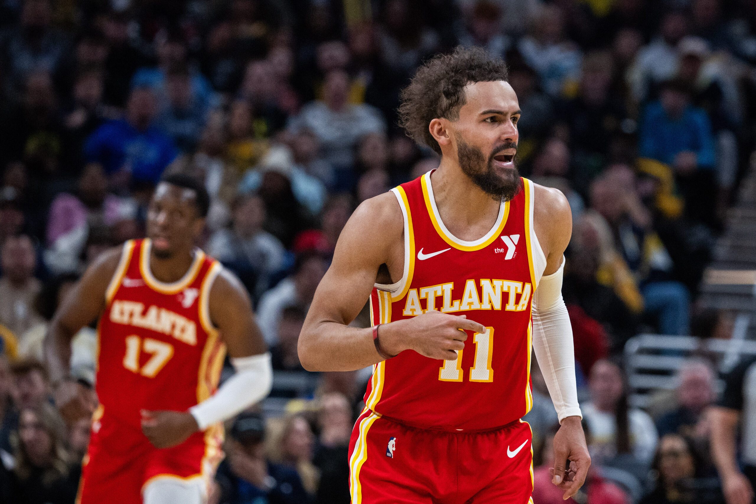 Feb 1, 2025; Indianapolis, Indiana, USA; Atlanta Hawks guard Trae Young (11) celebrates after a basket against the Indiana Pacers in the second half at Gainbridge Fieldhouse.