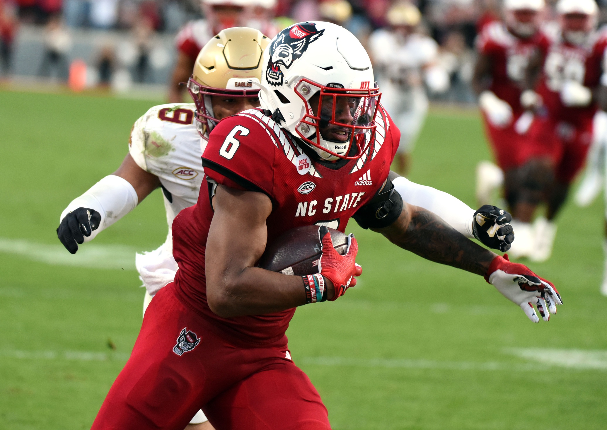 Nov 12, 2022; Raleigh, North Carolina, USA;North Carolina State Wolfpack tight end Trent Pennix (6) runs after a catch as Boston College Eagles defensive back Jaiden Woodbey (9) pursues during the first half at Carter-Finley Stadium.