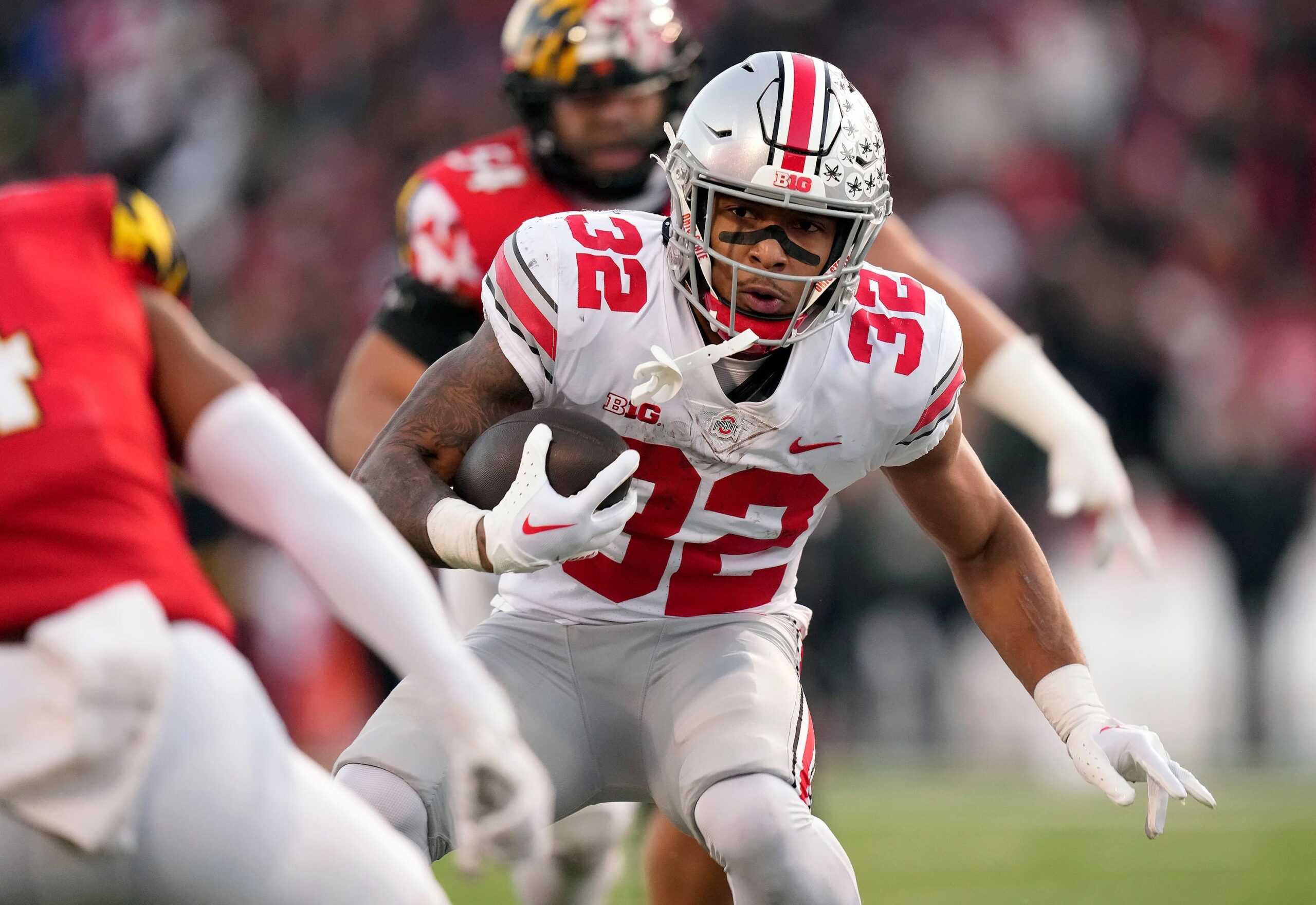 Nov 19, 2022; College Park, MD, USA; Ohio State Buckeyes running back TreVeyon Henderson (32) carries the ball against Maryland Terrapins in the second quarter of their Big Ten game at SECU Stadium.