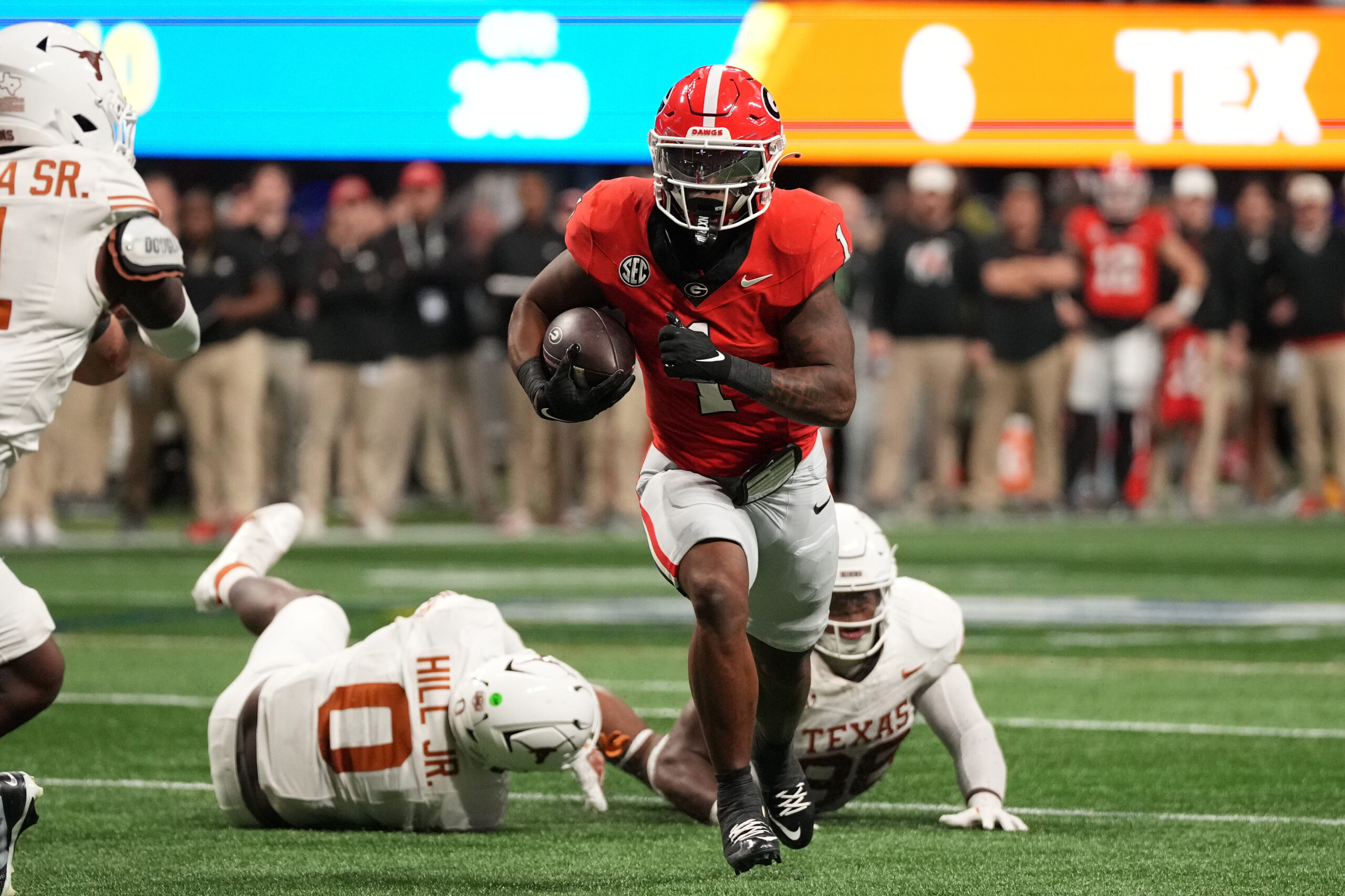 Dec 7, 2024; Atlanta, GA, USA; Georgia Bulldogs running back Trevor Etienne (1) rushes for a touchdown against the Texas Longhorns during the second half in the 2024 SEC Championship game at Mercedes-Benz Stadium.