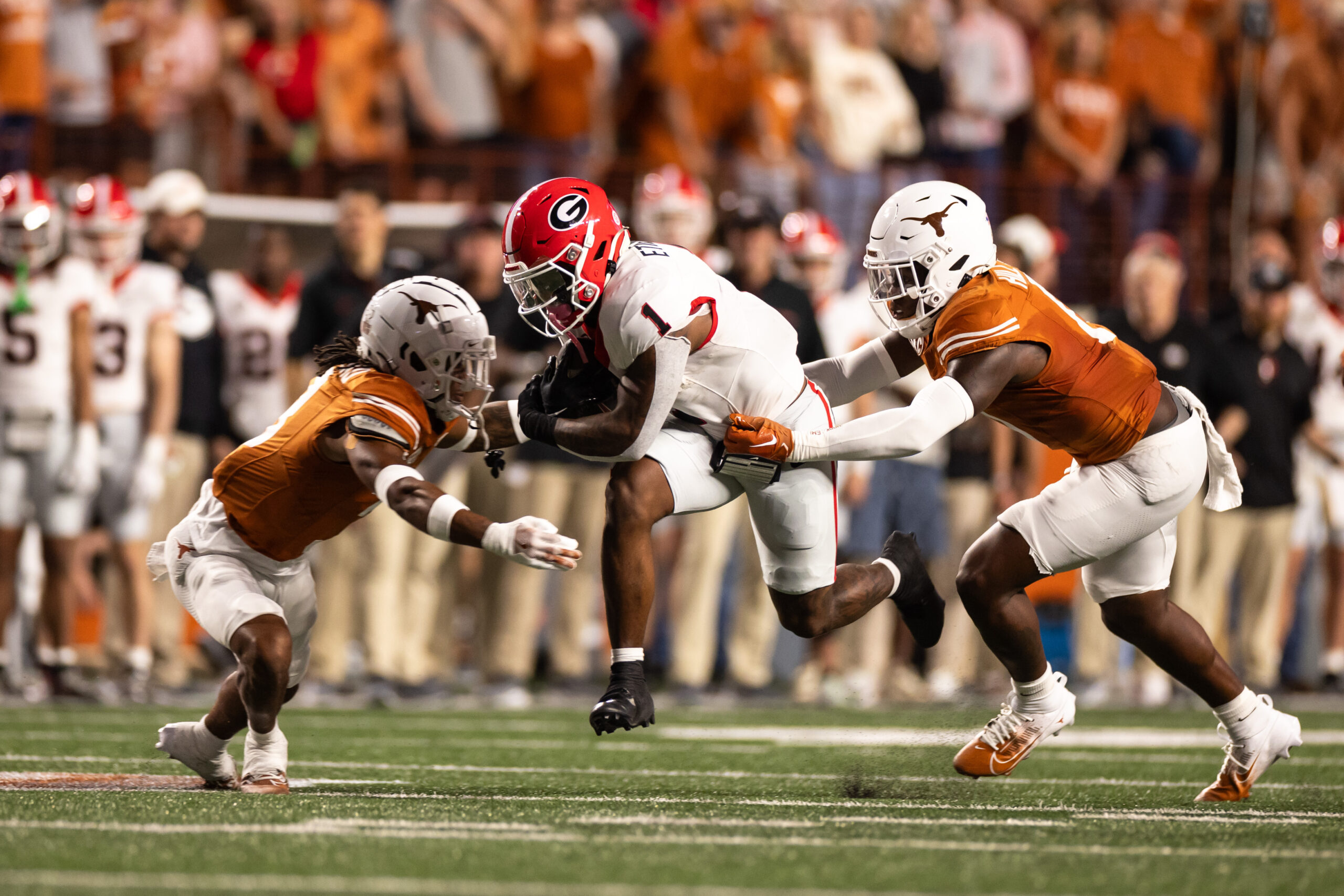 Oct 19, 2024; Austin, Texas, USA; Georgia Bulldogs running back Trevor Etienne (1) runs the ball against the Texas Longhorns during the first half at Darrell K Royal-Texas Memorial Stadium.